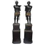 A pair of large Venetian polychromed figural torchères 19th century Finely modeled, the stately