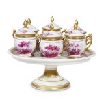 A set of six Paris porcelain pots de crème on stand 19th century Each decorated in puce camaïeu