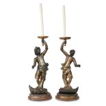 An associated pair of Venetian polychromed figural torchères 19th century Now wired as lamps. (2).