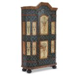 A fine Northern European painted armoire likely Swiss, dated 1834 The faux marble background painted