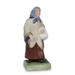 A Soviet porcelain group "Jewish Woman With a Bundle" Dmitrovsk Manufactory, Verbilki, circa 1930