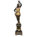 A Venetian polychromed figural torchère on pedestal late 19th/early 20th century H: 48 in.