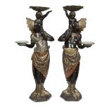 An unusual pair of large Venetian polychromed figural torchères late 19th century Each in the form