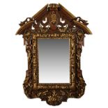An Italian Renaissance style parcel-gilt walnut frame mid 19th century The rectangular mirror