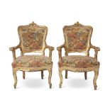 A pair of Venetian giltwood armchairs 19th century With needlepoint upholstery. (2). H: 39, W: 26
