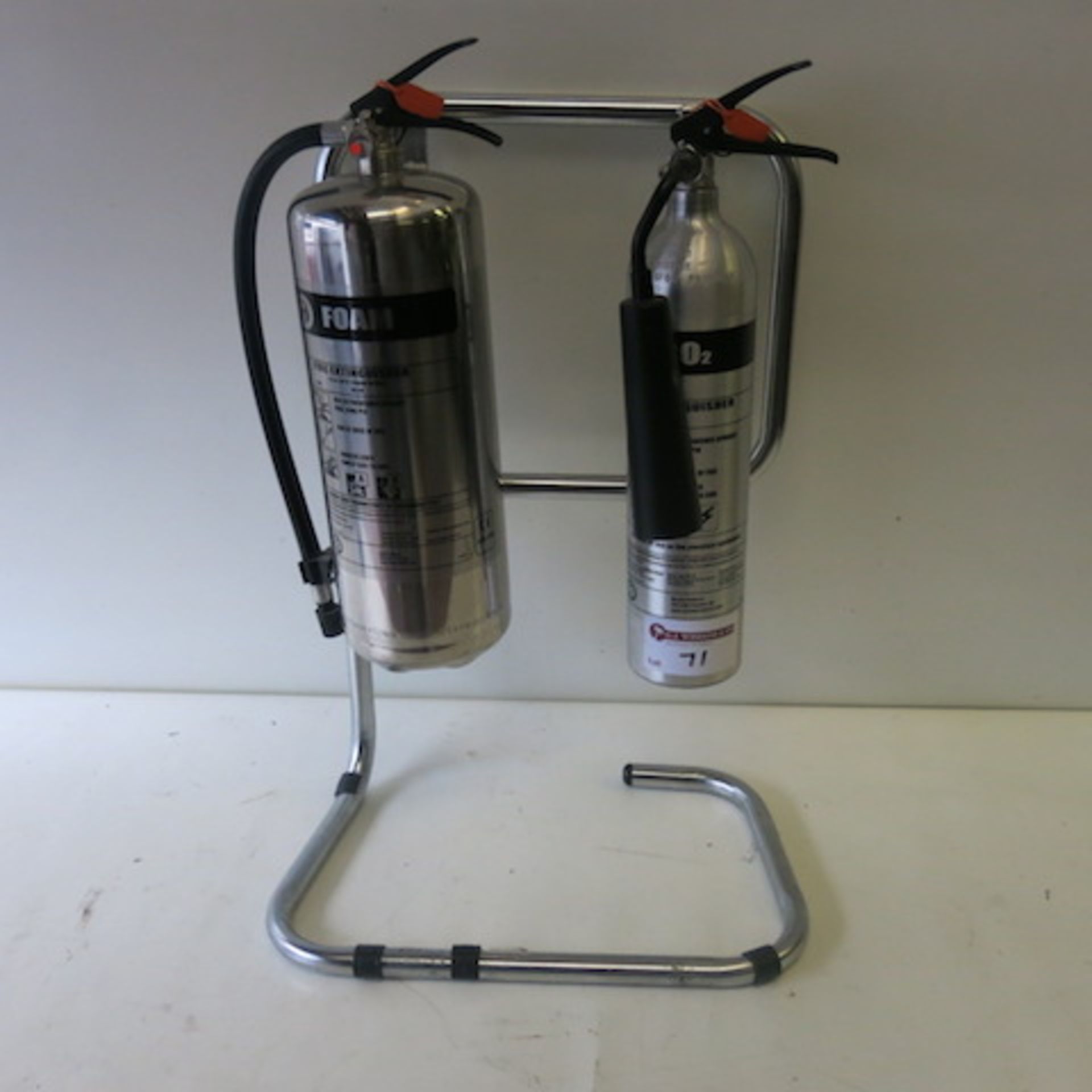 2 x Stainless Steel/Aluminum Fire Extinguishers on Frame, 1 Foam, 1 Carbon Dioxide, Discharge Date