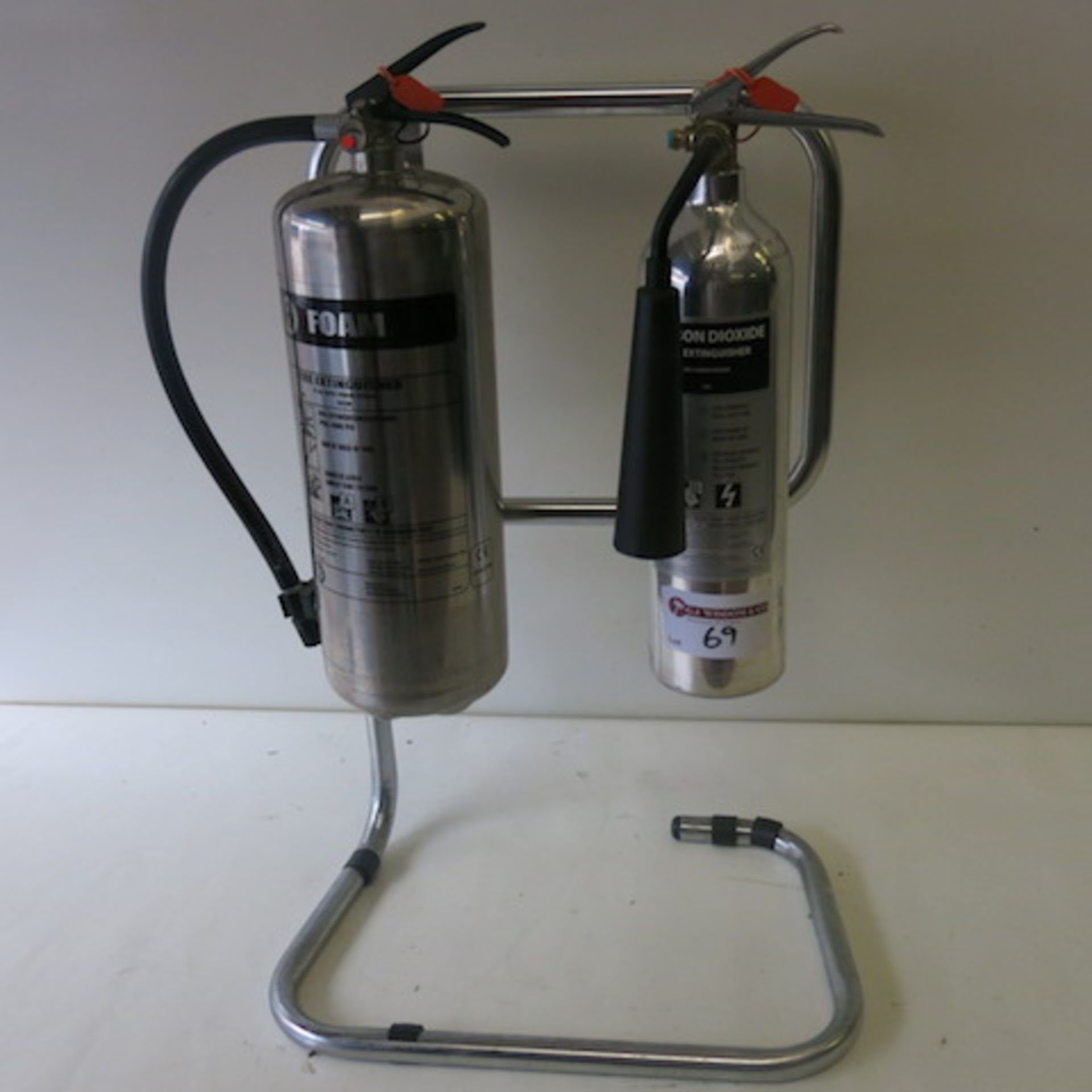 2 x Stainless Steel/Polished Aluminum Fire Extinguishers on Frame, 1 Foam, 1 Carbon Dioxide,