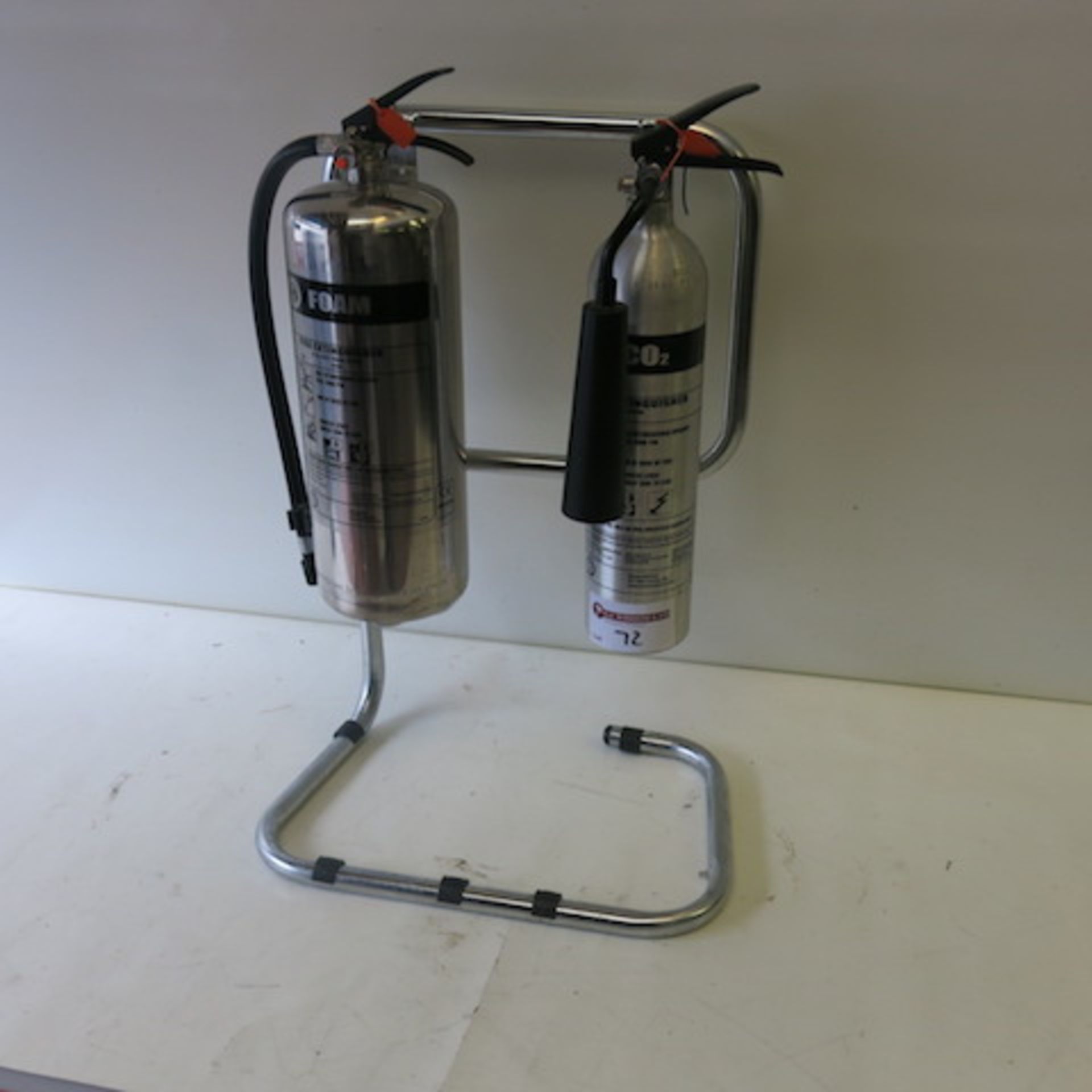 2 x Stainless Steel/Aluminum Fire Extinguishers on Frame, 1 Foam, 1 Carbon Dioxide, Discharge Date