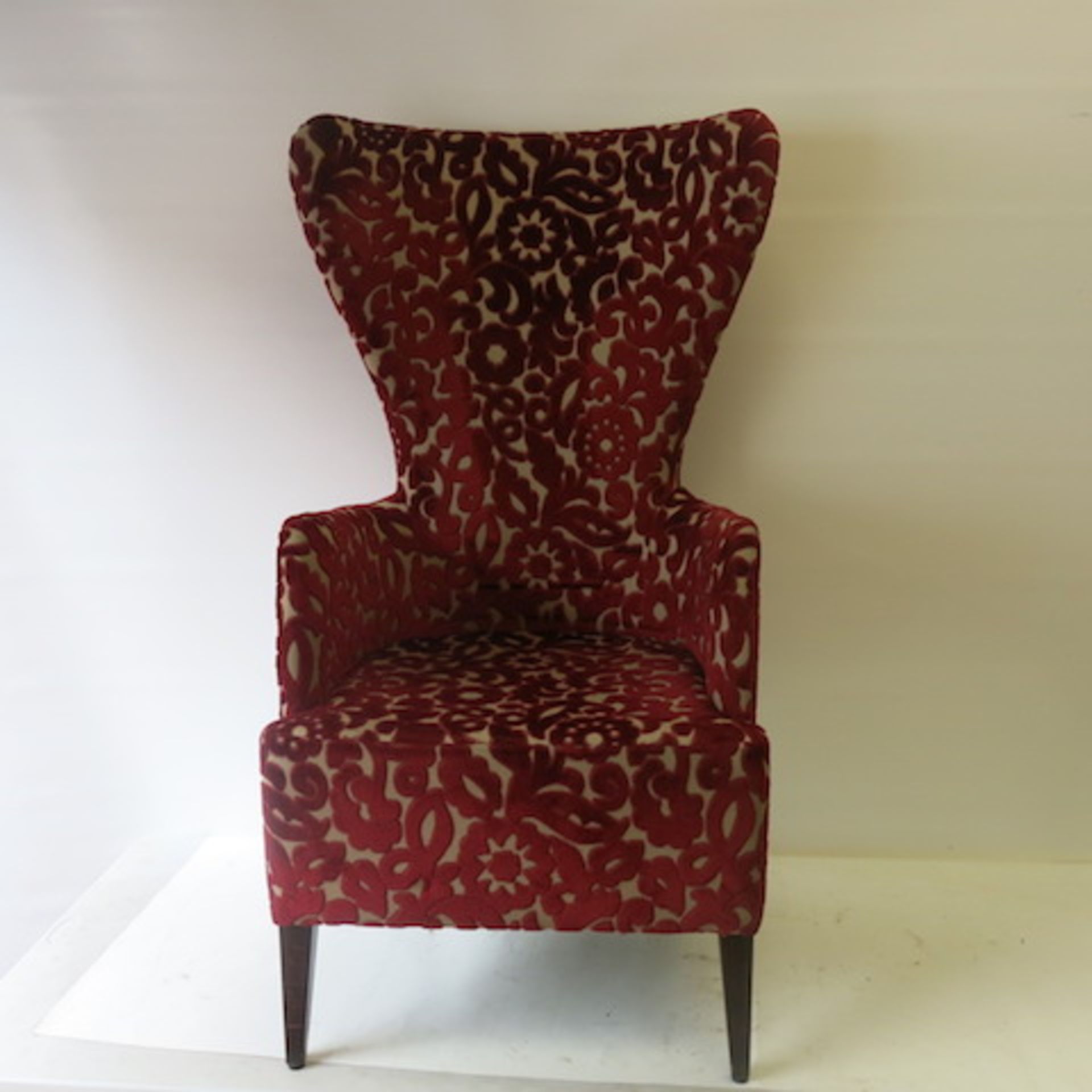 A High Back Wing Armchair with Crushed Velour Pattern in Deep Red & Cream, appears in good condition
