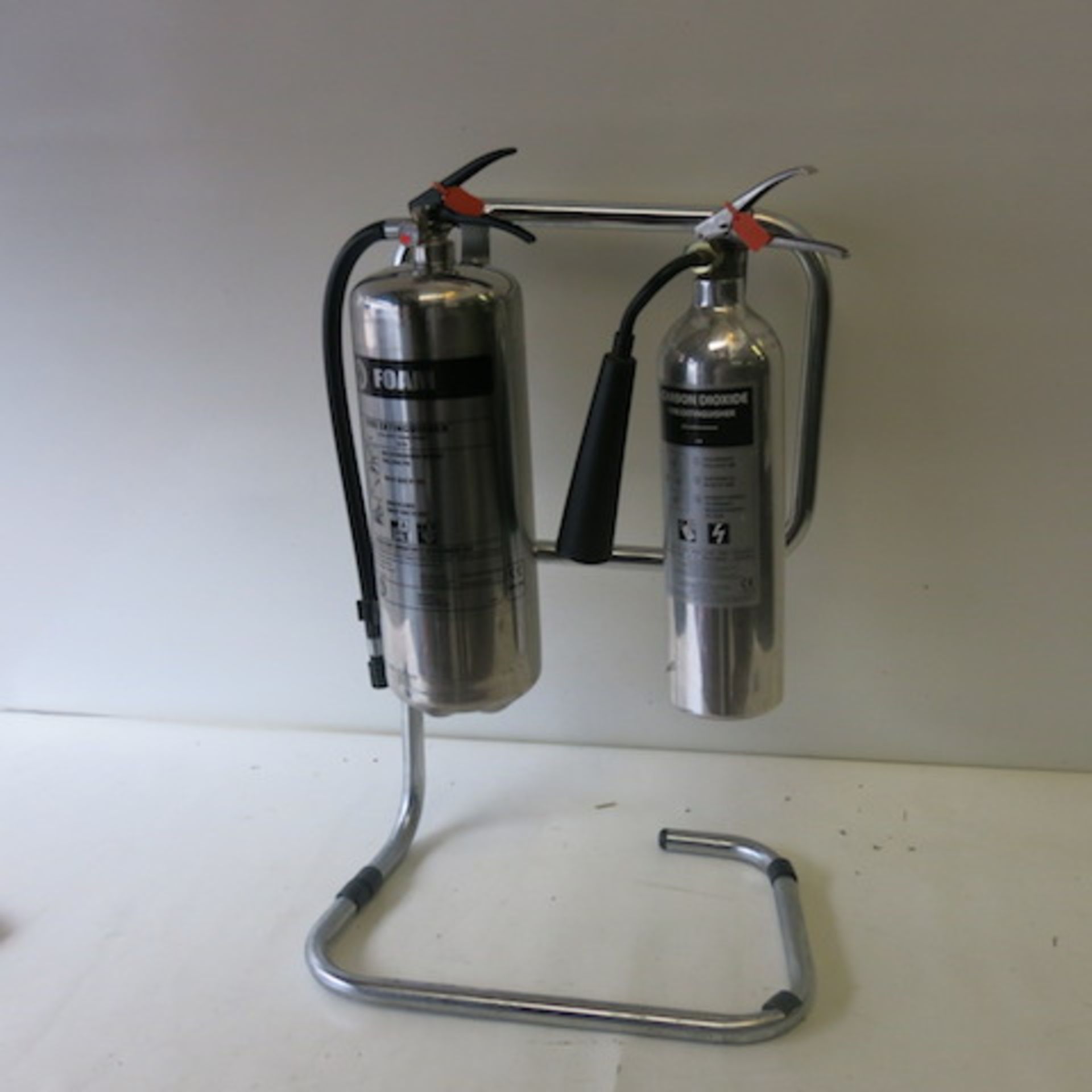 2 x Stainless Steel/Polished Aluminum Fire Extinguishers on Frame, 1 Foam, 1 Carbon Dioxide,