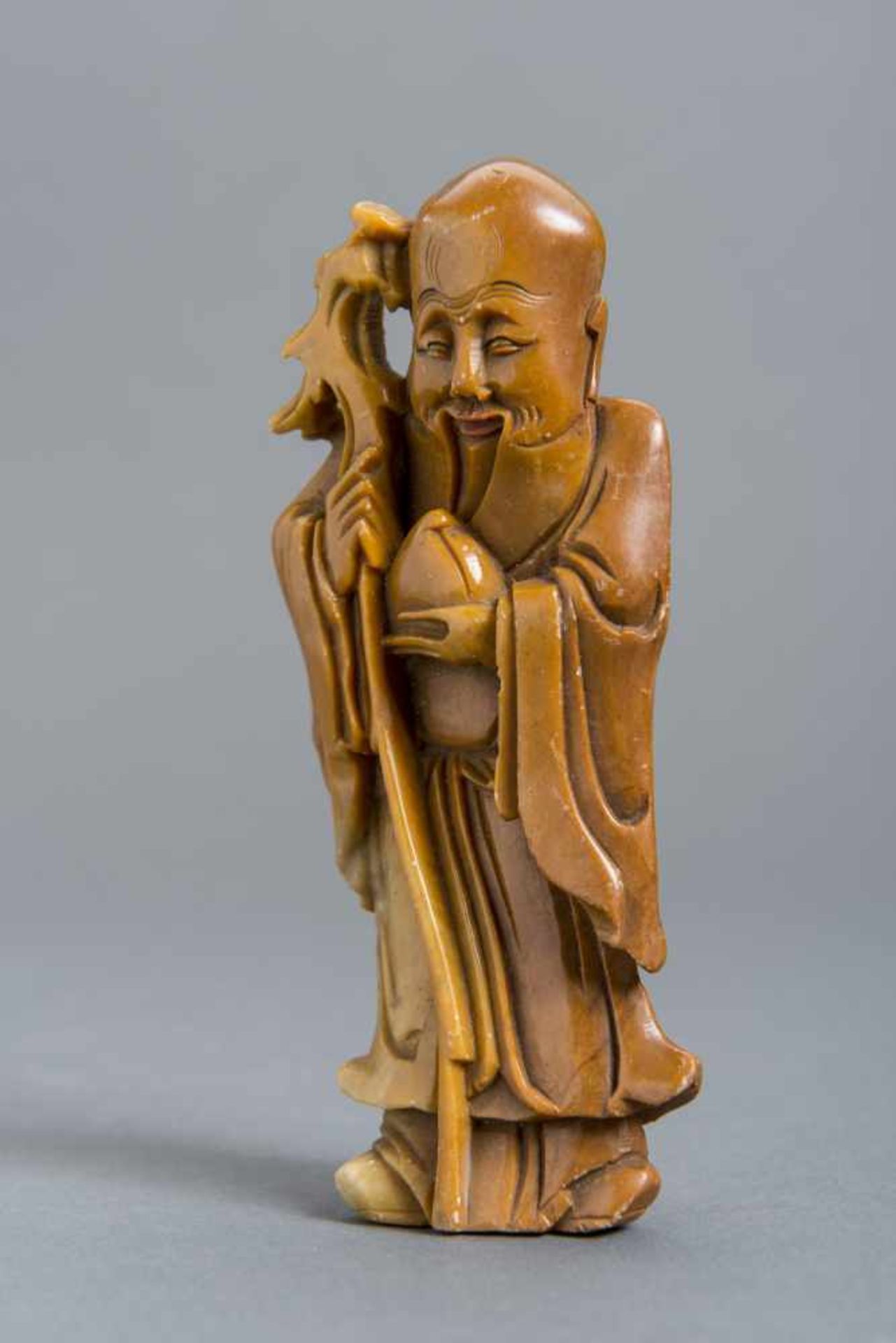 SOAPSTONE CARVING OF A LUCK DEITY Soapstone with some coloring. China, 19th – early 20th cent.HEIGHT - Image 2 of 5