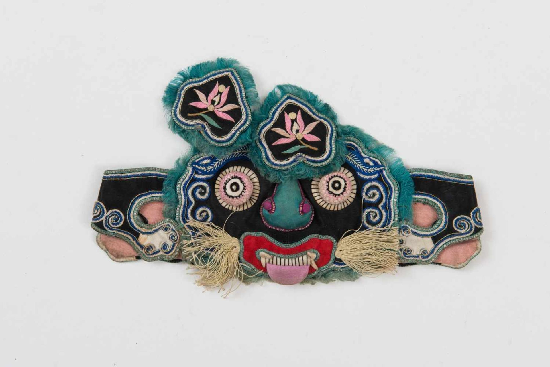 HEADBAND FOR CHILDREN WITH ROBBER FACE Silk. China, Qing, 19th – early 20th century An enchanting,