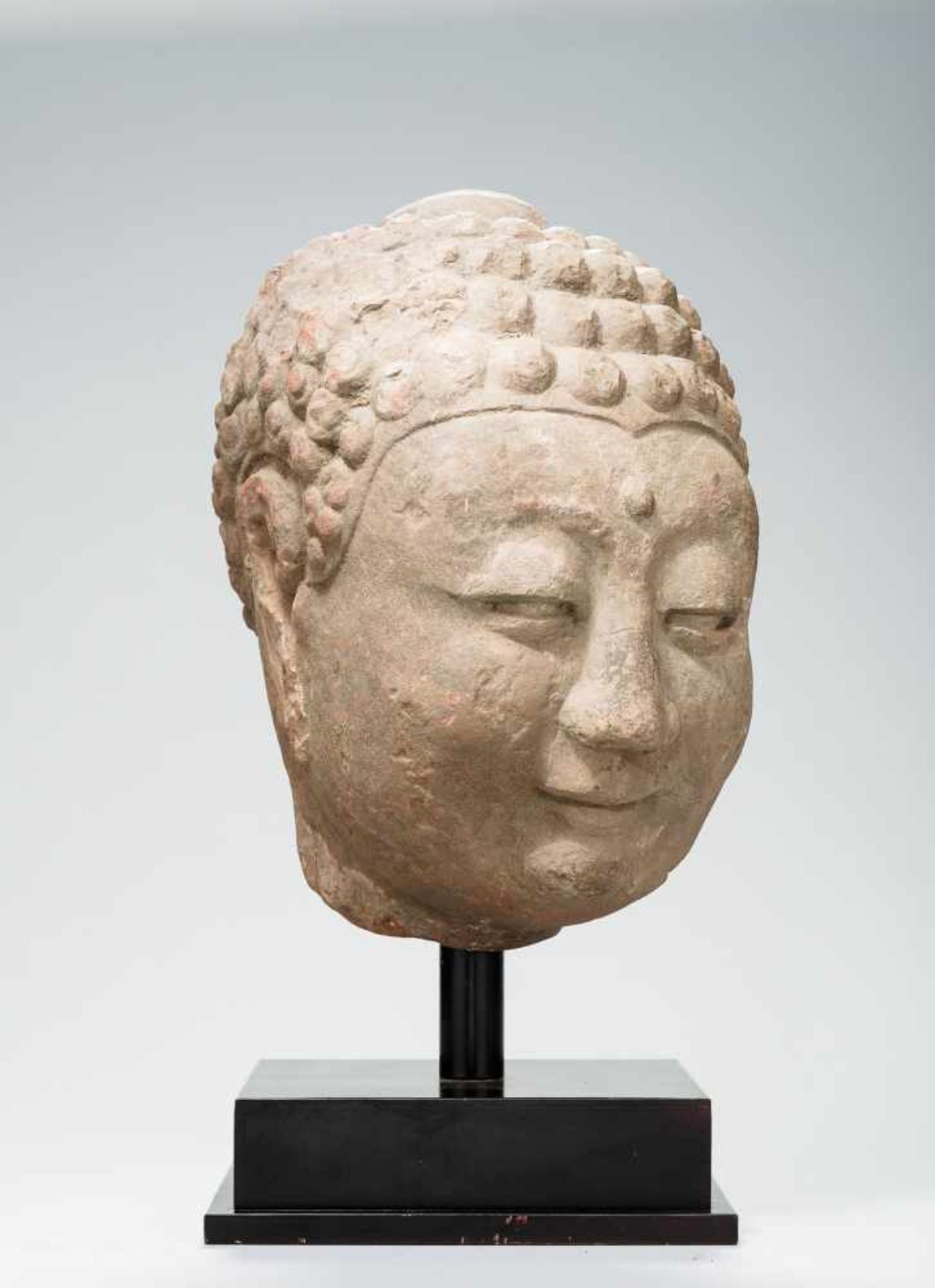 A LARGE HEAD OF A BUDDHA Red sandstone. China, Song Dynasty, approx. 12th / 13th century A rare