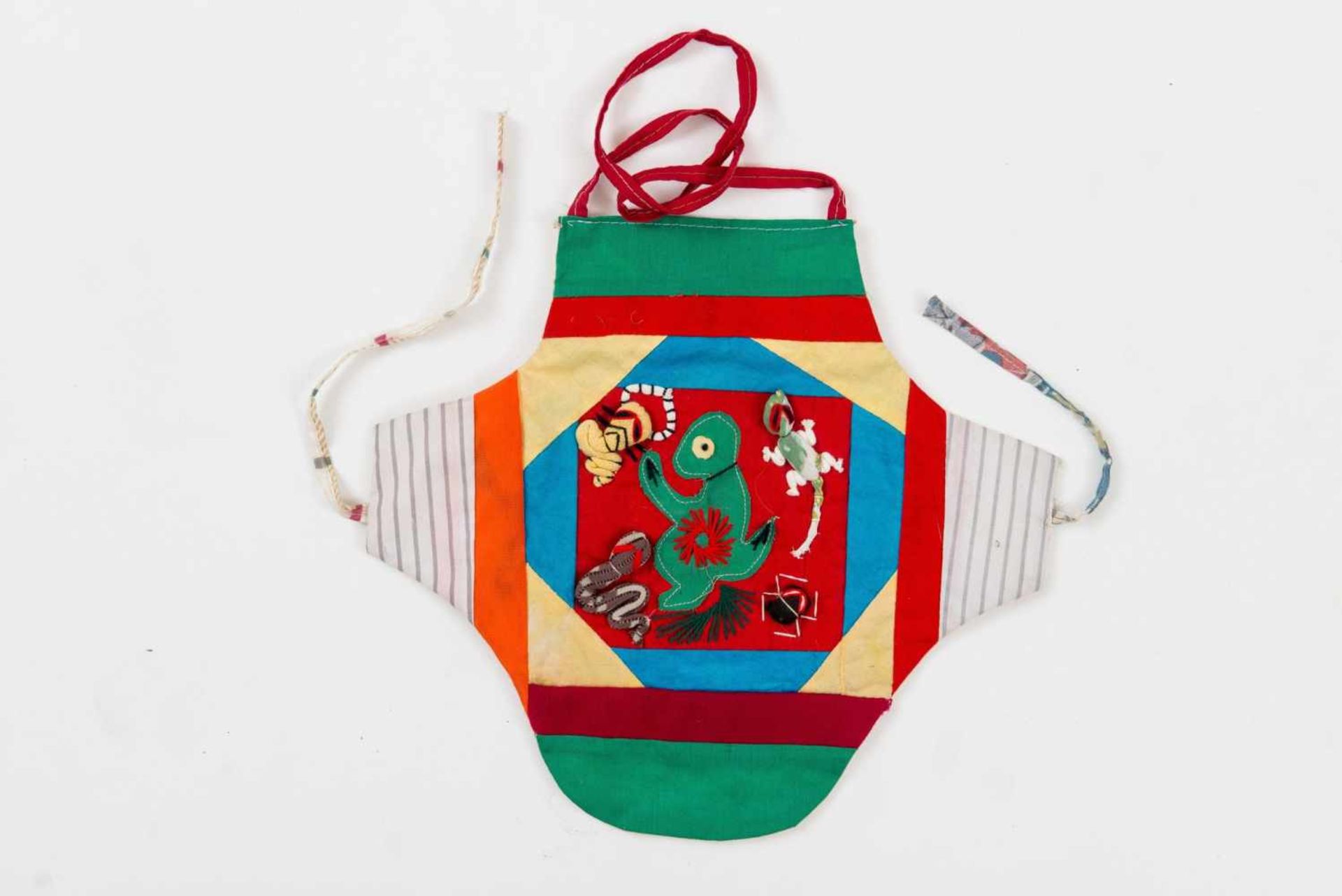 CHILD’S APRON Silk. China, 20th century Applications with animals, different colored fabric strips