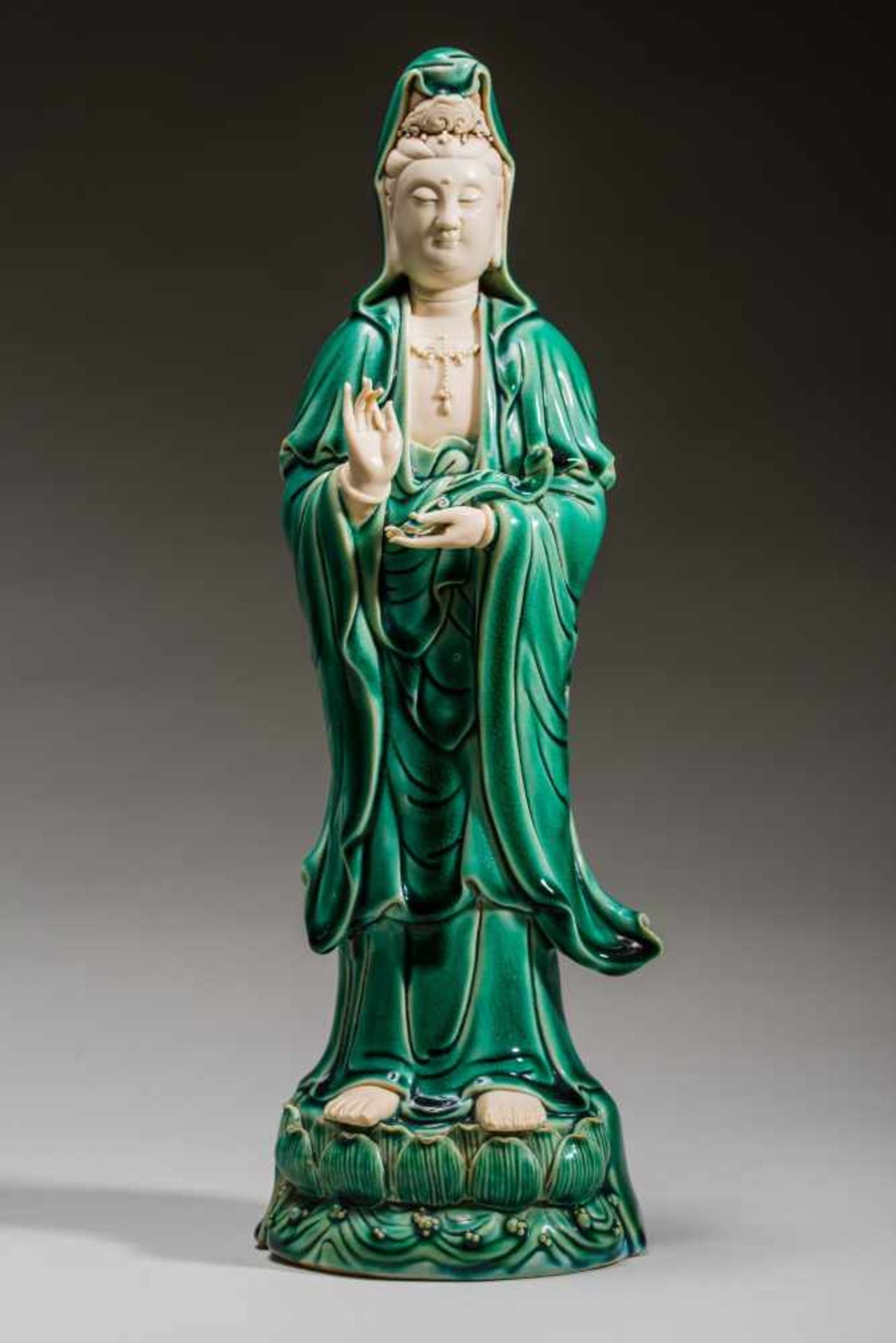 THE STANDING GODDESS GUANYIN Porcelain. China, The goddess Guanyin standing up straight atop sea