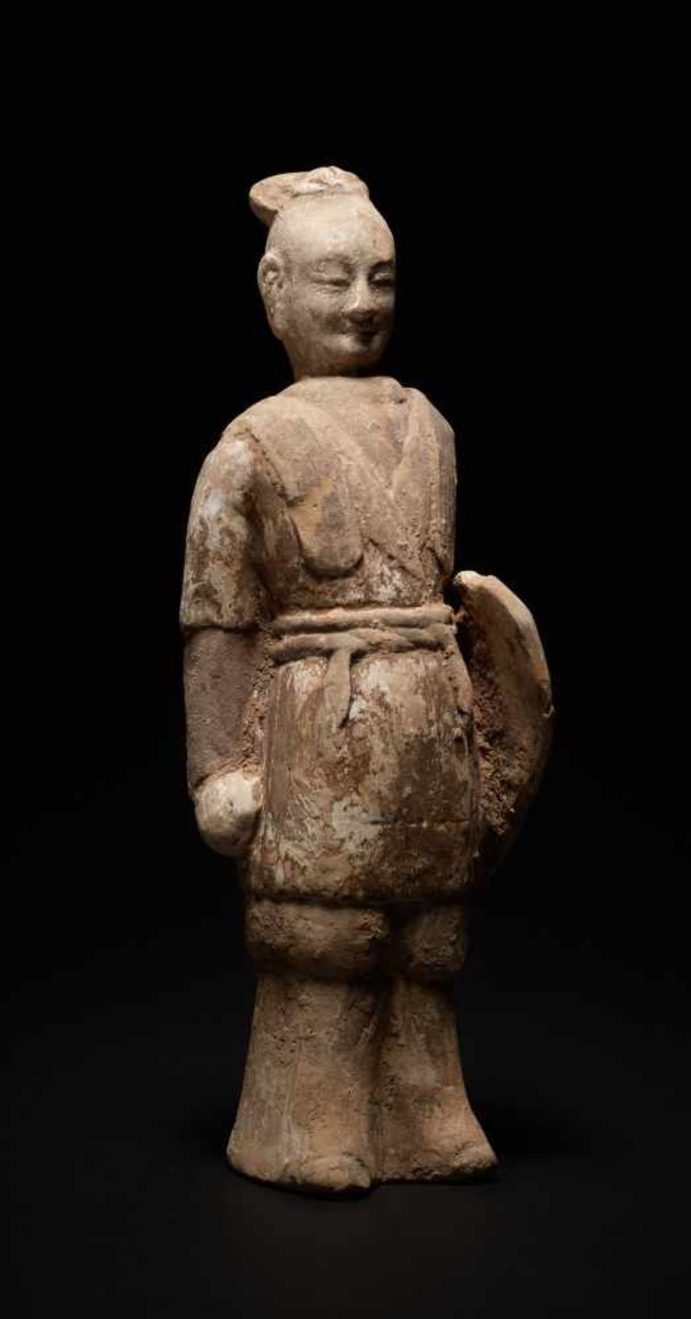 WARRIOR WITH SHIELD Terracotta with painting. China, Northern Qi Dynasty (550 - 589) Figurine with