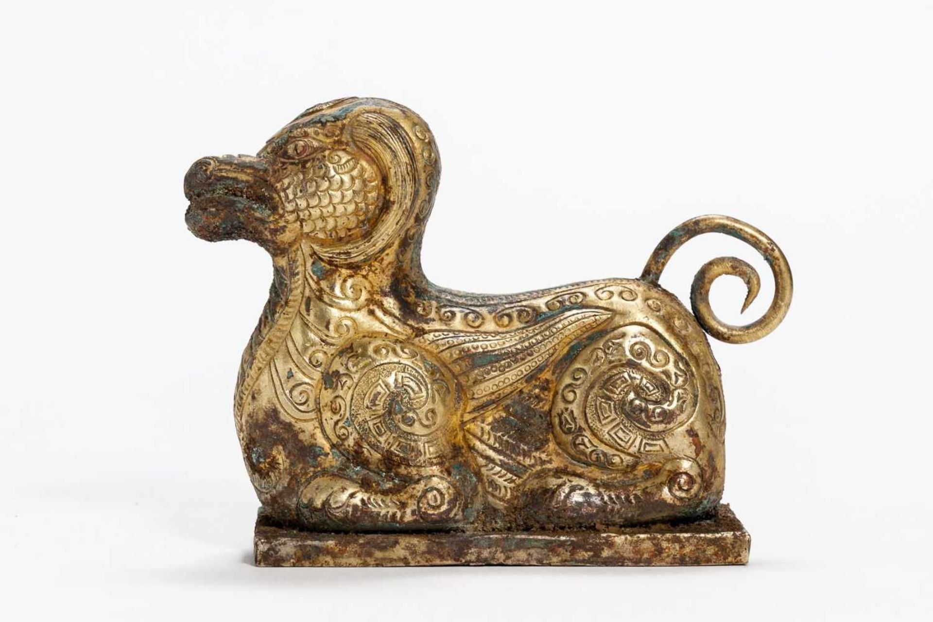 MYTHICAL ANIMAL Copper repoussé with fire gilding. China, presumably Qing-dynasty In archaic