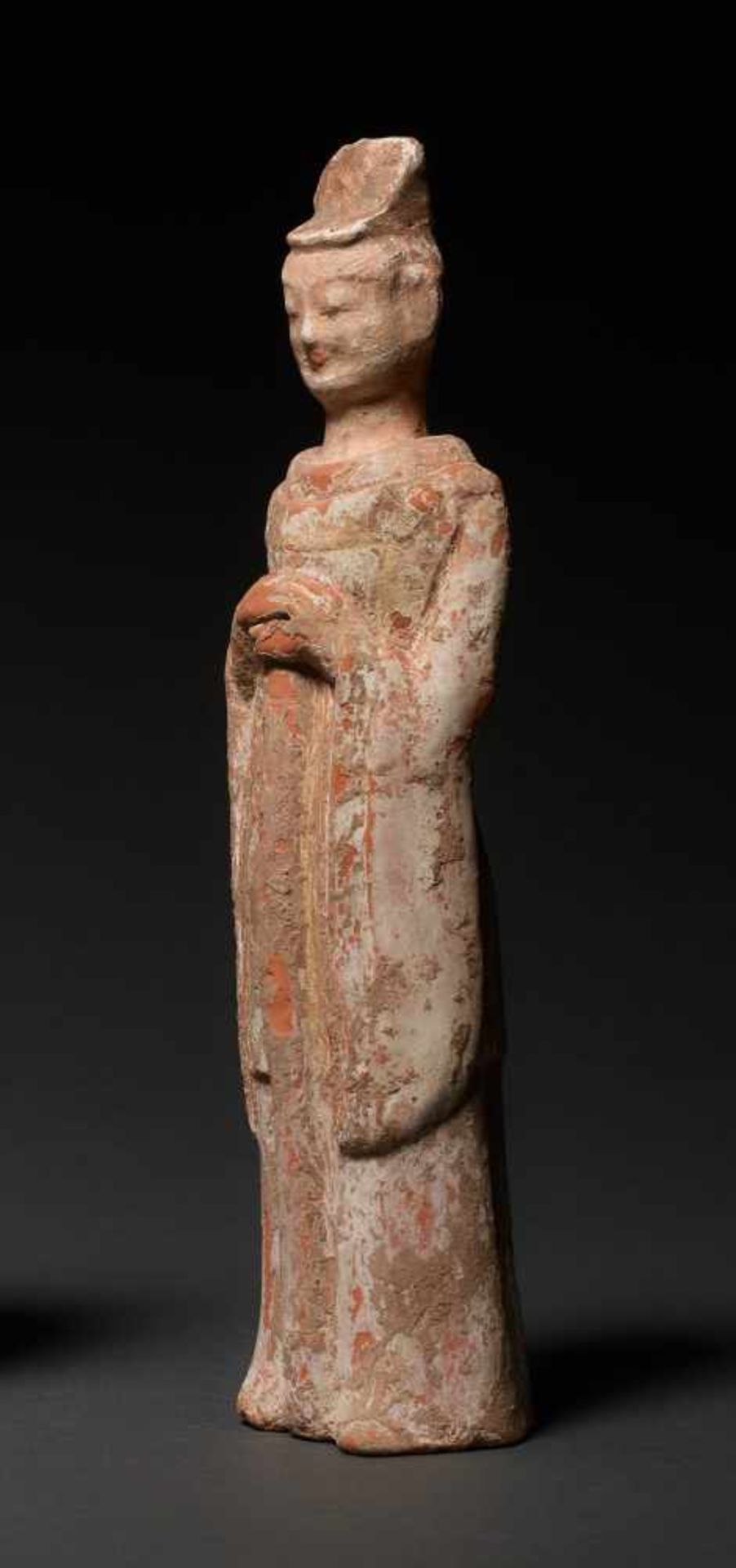 COURTIER Terracotta with painting. China, Wei Dynasty (5th to 6th cent.) A rare smaller figure