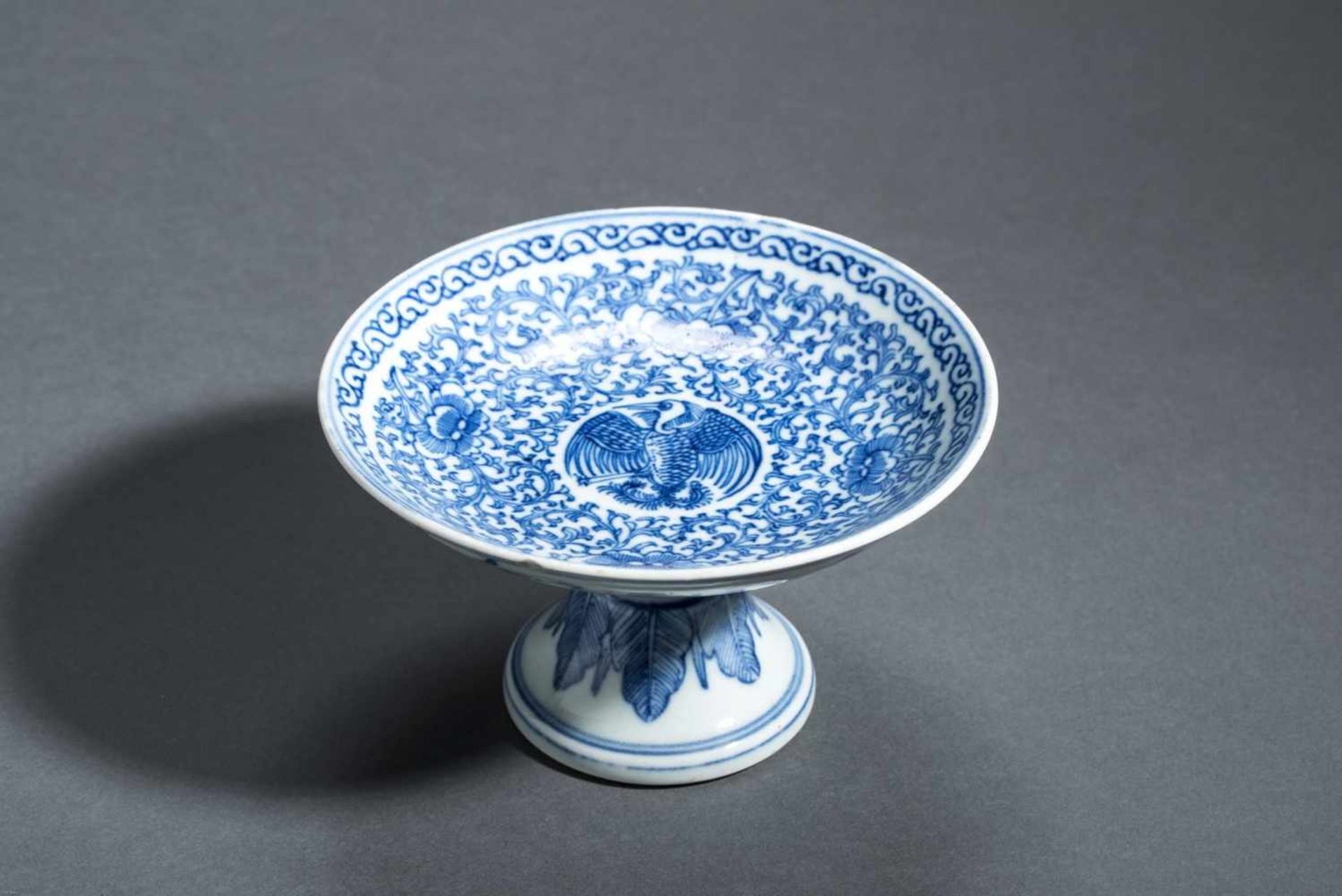 FOOTED DISH WITH BIRD AND LOTUS BLOSSOMS Blue-white porcelain. China, Qing Dynasty, 19th cent.