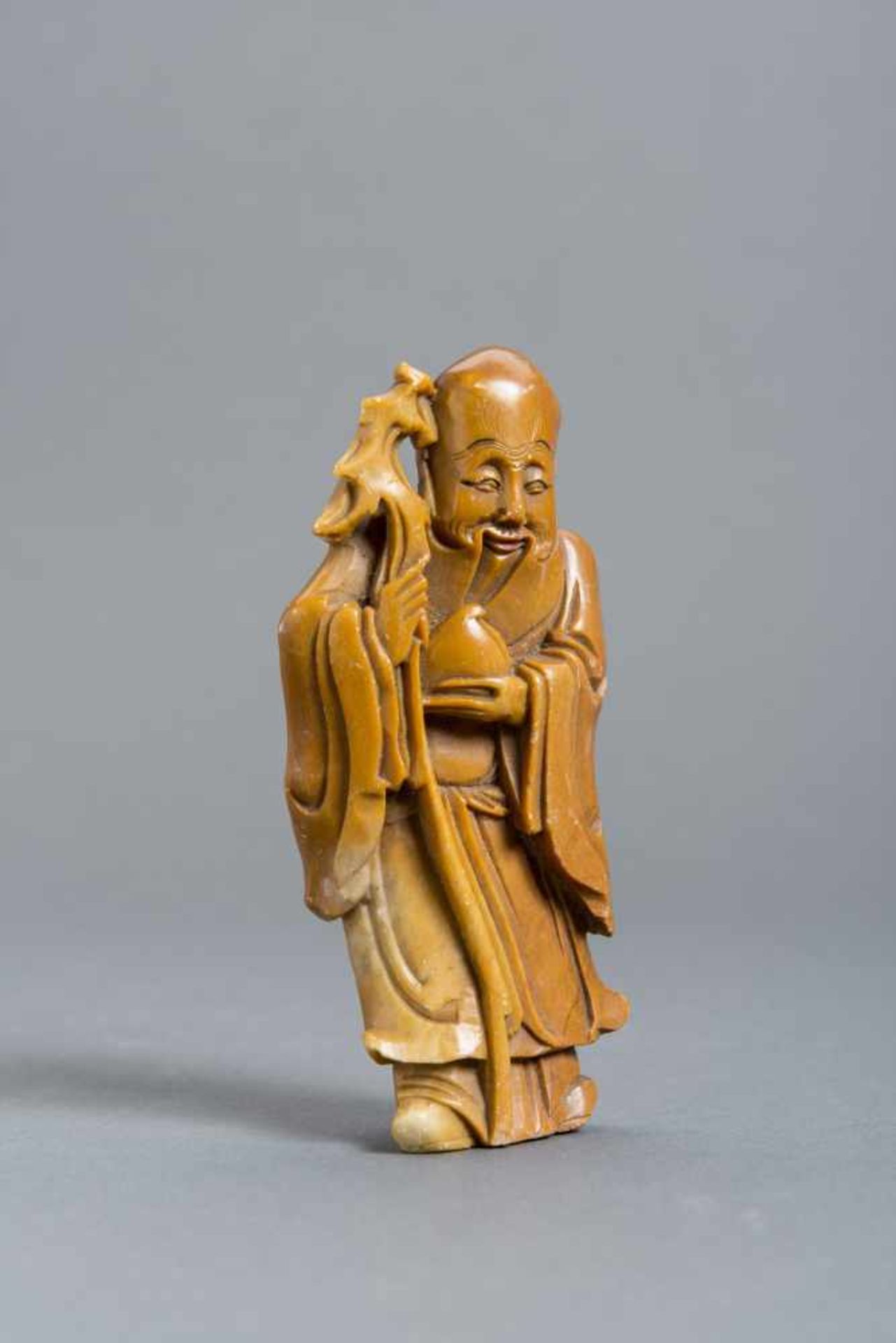 SOAPSTONE CARVING OF A LUCK DEITY Soapstone with some coloring. China, 19th – early 20th cent.HEIGHT - Image 3 of 5