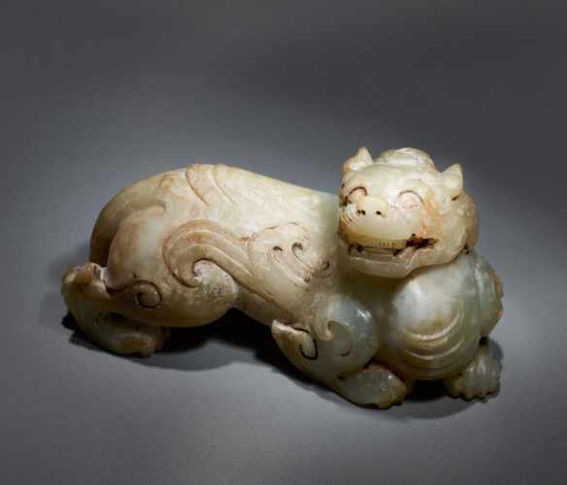 A POWERFUL AND EXQUISITE WINGED MYTHICAL ANIMAL (BIXIE) CARVED IN KHOTAN JADE Jade, China. Western