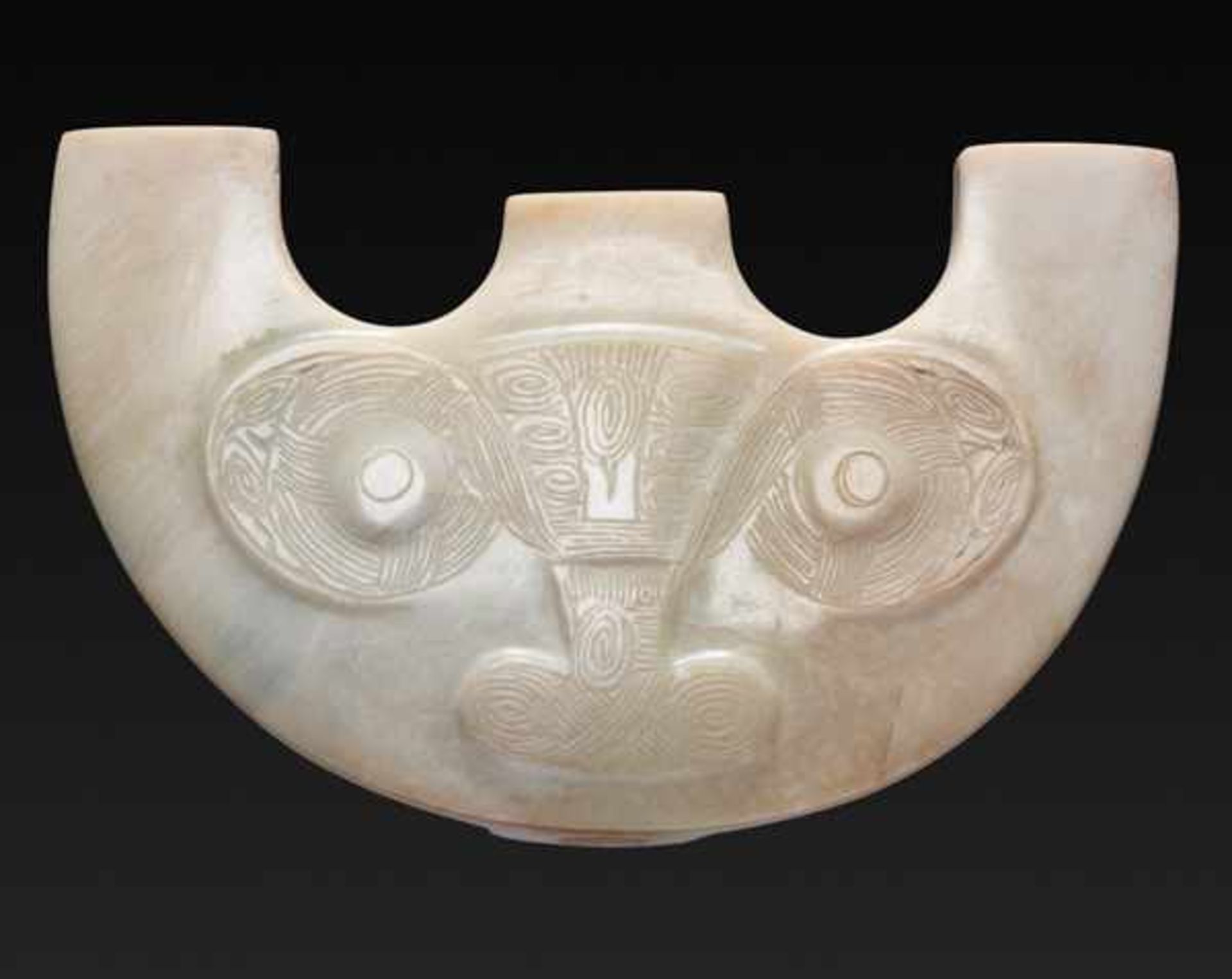 A RARE THREE-PRONGED ORNAMENT WITH ANIMAL MASK MOTIF Jade, China. Late Neolithic period, Liangzhu