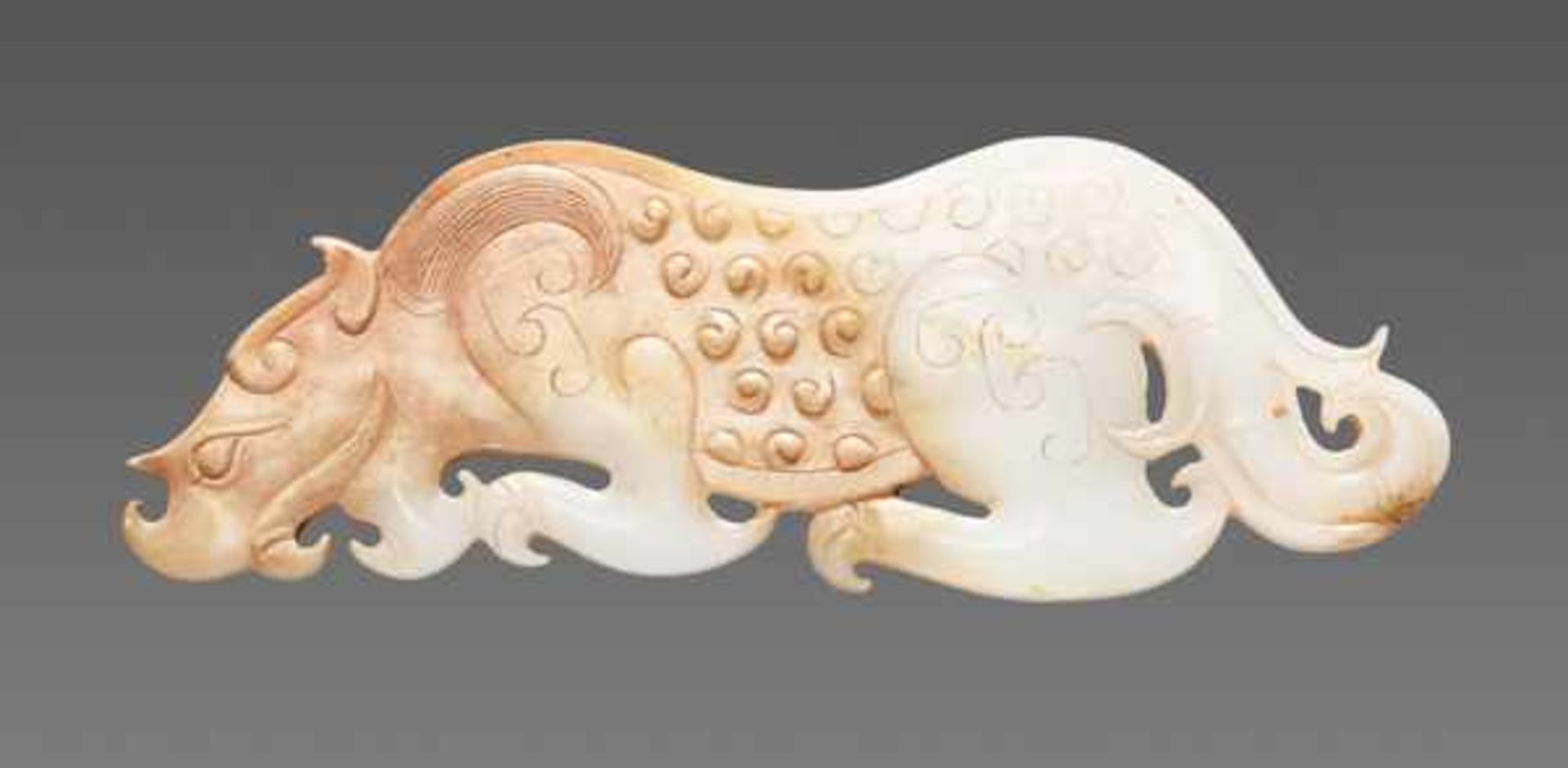 AN AMAZING CROUCHING TIGER IN WHITE JADE Jade, China. Western Han, 3rd - 2nd century BC 虎形玉飾 - 西漢,