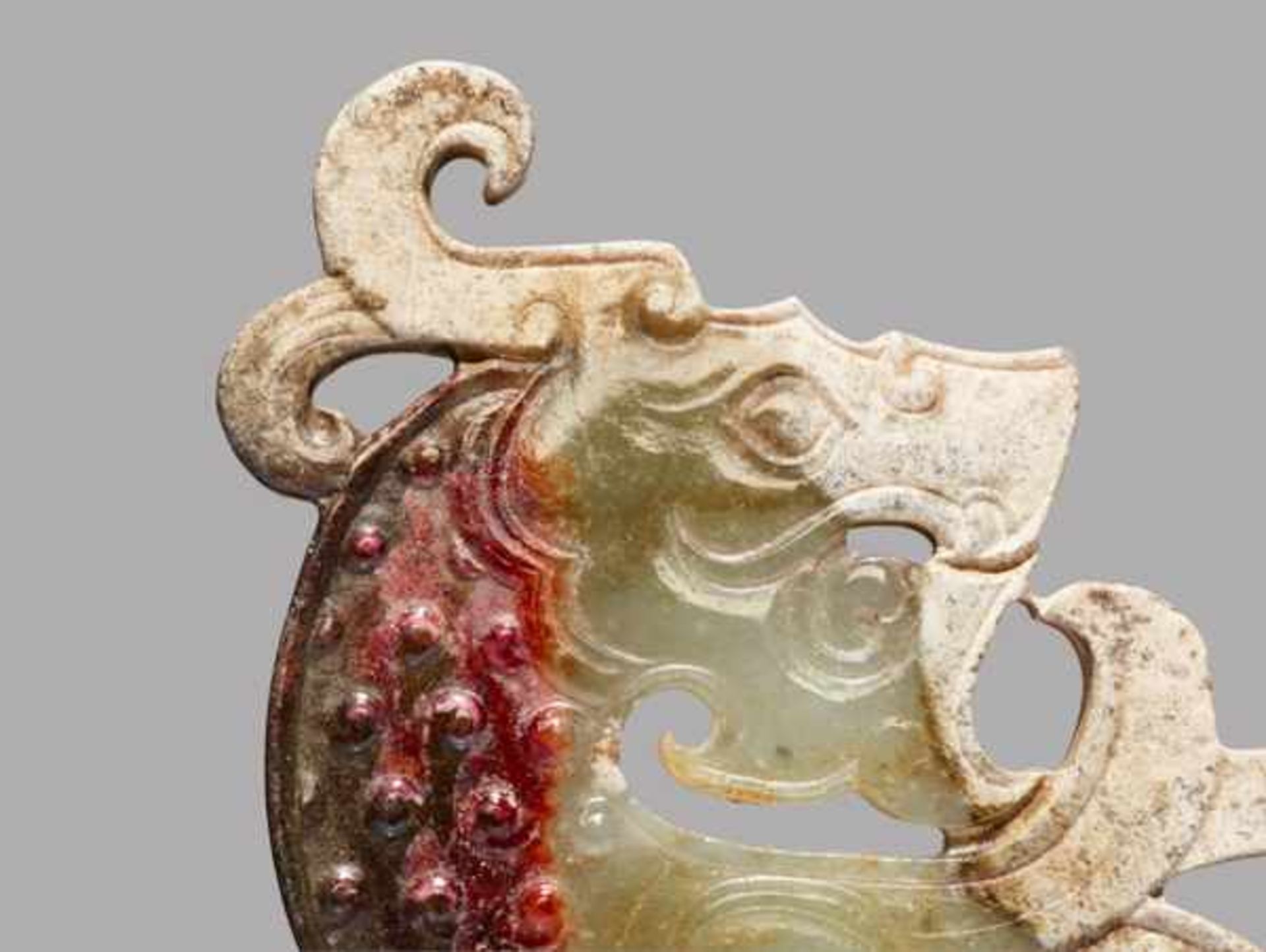 A STRIKING KUI S-SHAPED DRAGON IN WHITE JADE WITH A BROWN STRIPE Jade, China. Early Western Han - Image 3 of 7