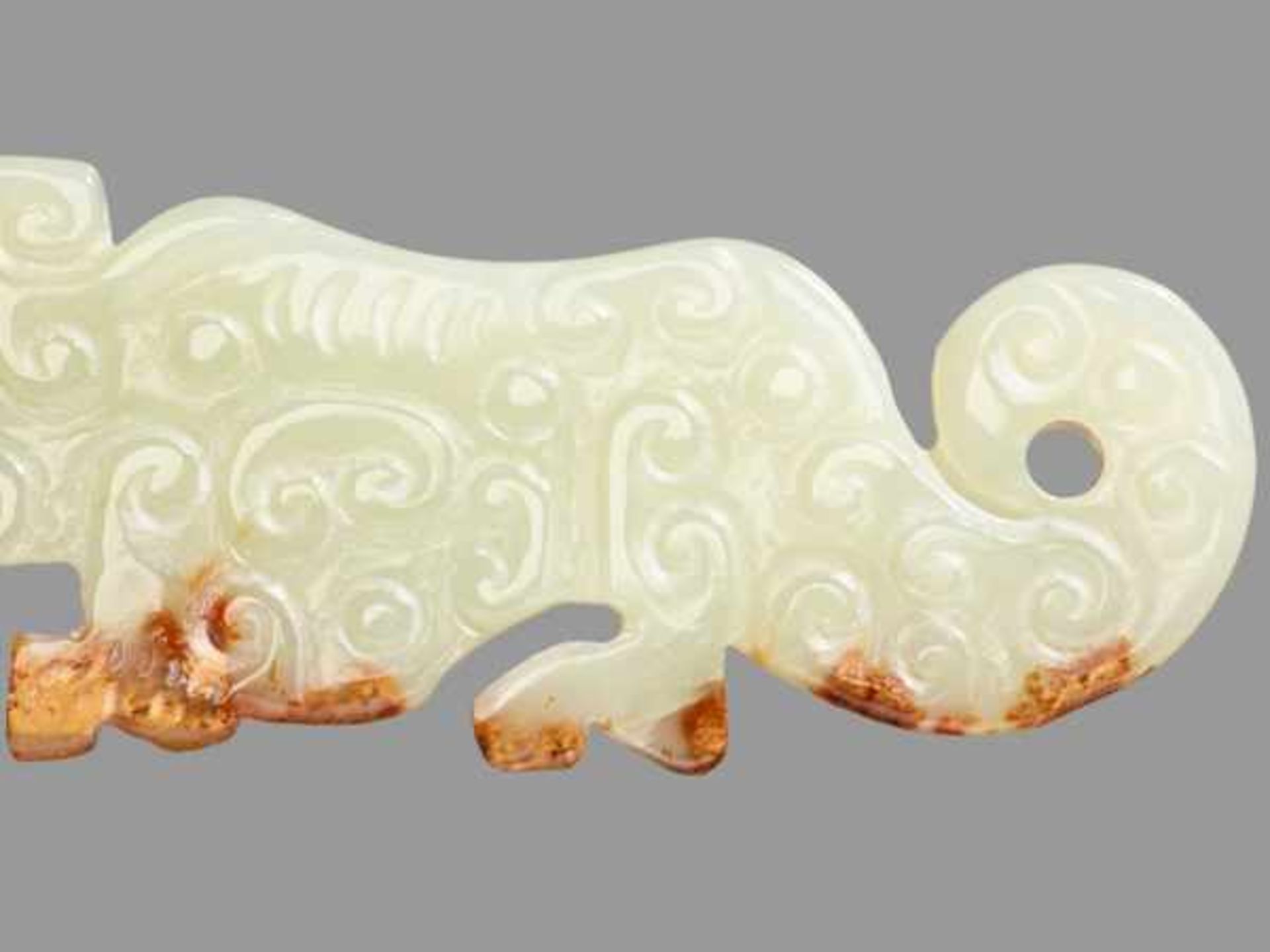 SMALL TIGER-SHAPED ORNAMENT IN TRANSLUCENT GREEN JADE Jade, China. Eastern Zhou, late Spring and - Image 3 of 8