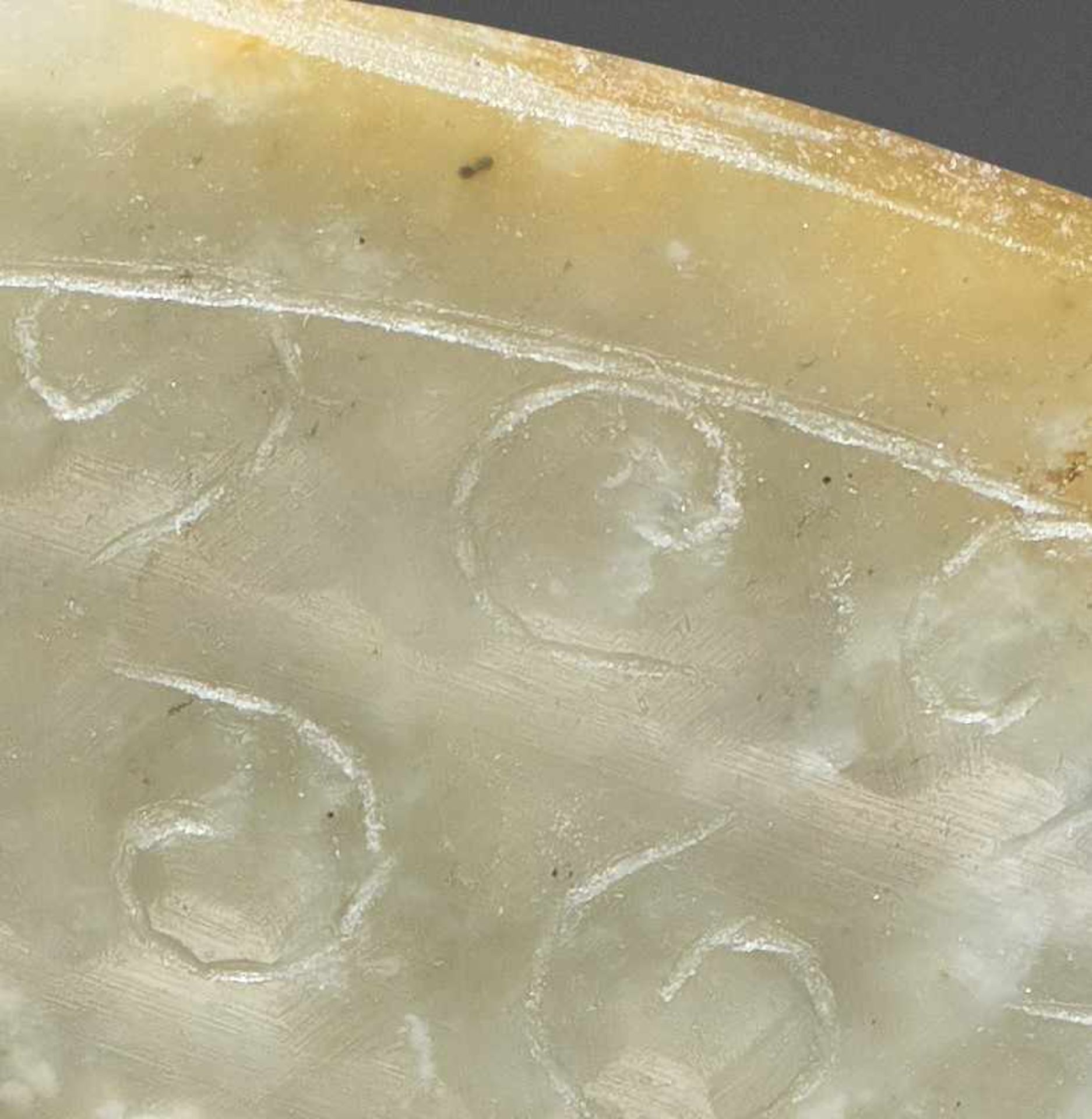 A TRANSLUCENT PALE GREEN DISC DECORATED WITH A PATTERN OF INCISED SPIRALS Jade, China. Western Han - Image 6 of 6