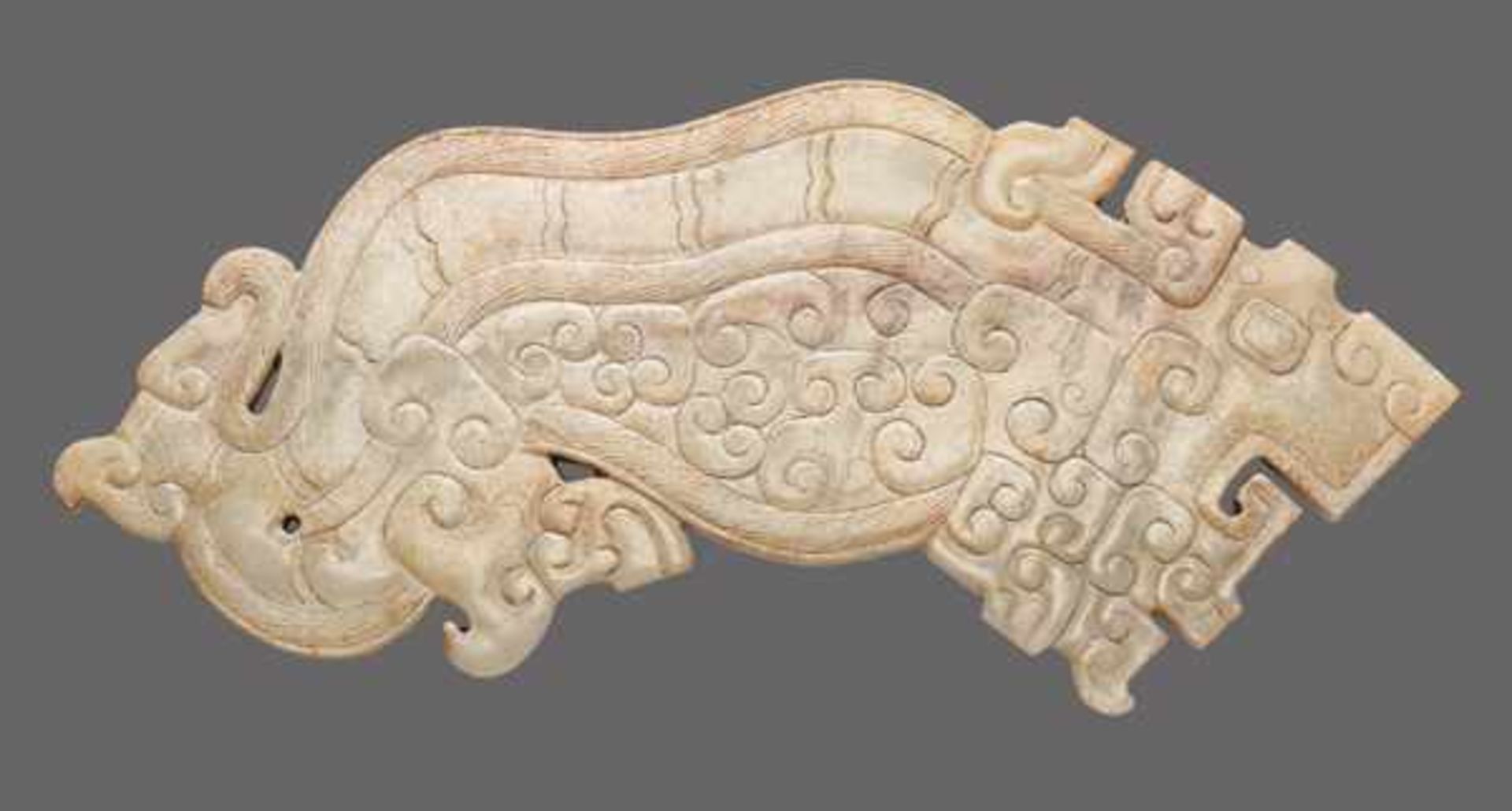 EXQUISITELY CARVED TIGER IN SEMI-TRANSLUCENT JADE Jade, China. Eastern Zhou, Warring States