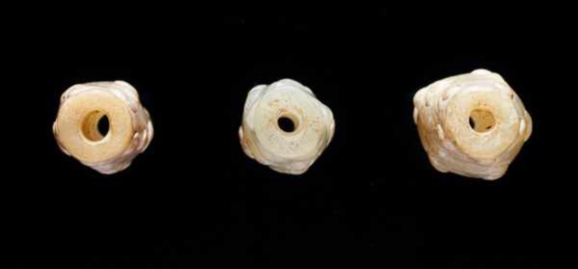 THREE TINY BEADS IN WHITE JADE WITH DELICATELY CARVED SCROLLS IN RELIEF Jade, China. Eastern Zhou, - Image 5 of 8