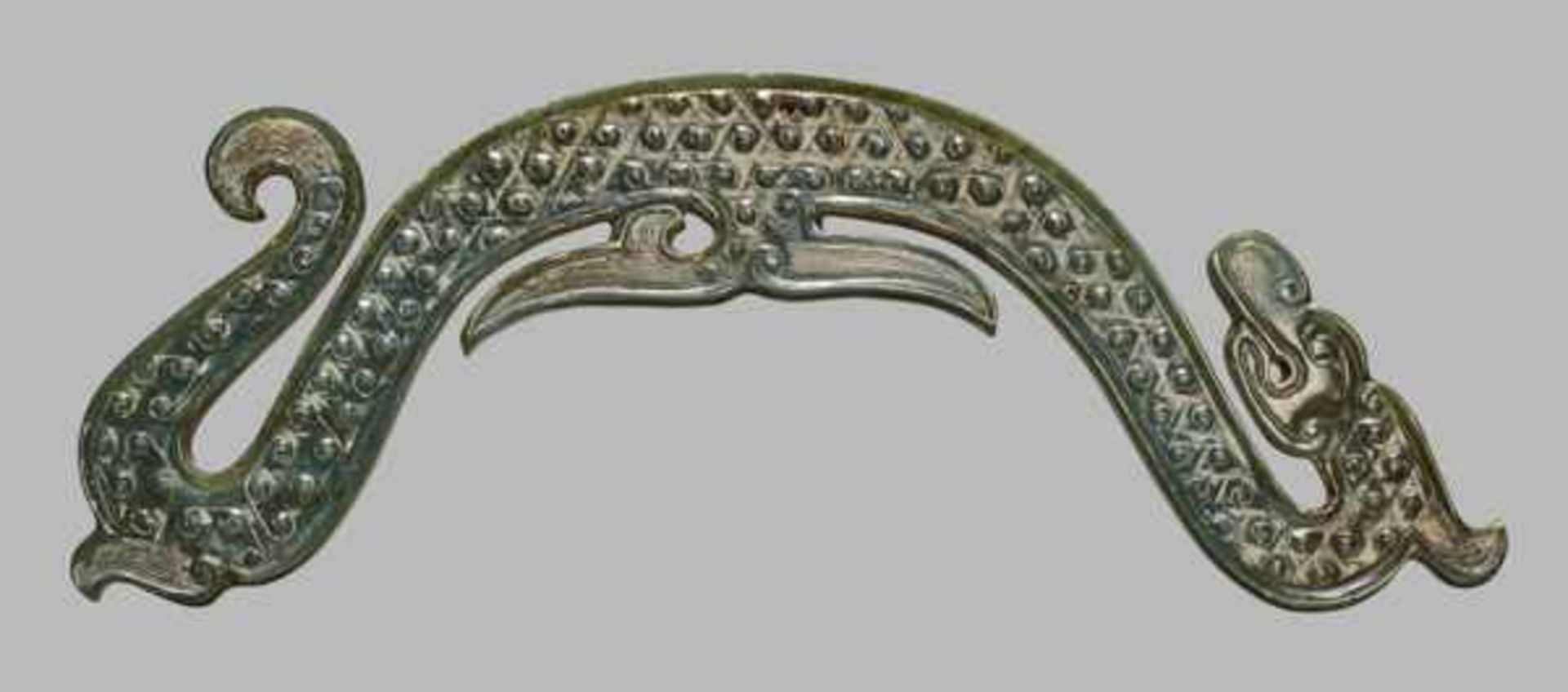 AN EXTREMELY RARE SPINACH GREEN JADE ARCHED DRAGON Jade, China. Eastern Zhou, Warring States period,