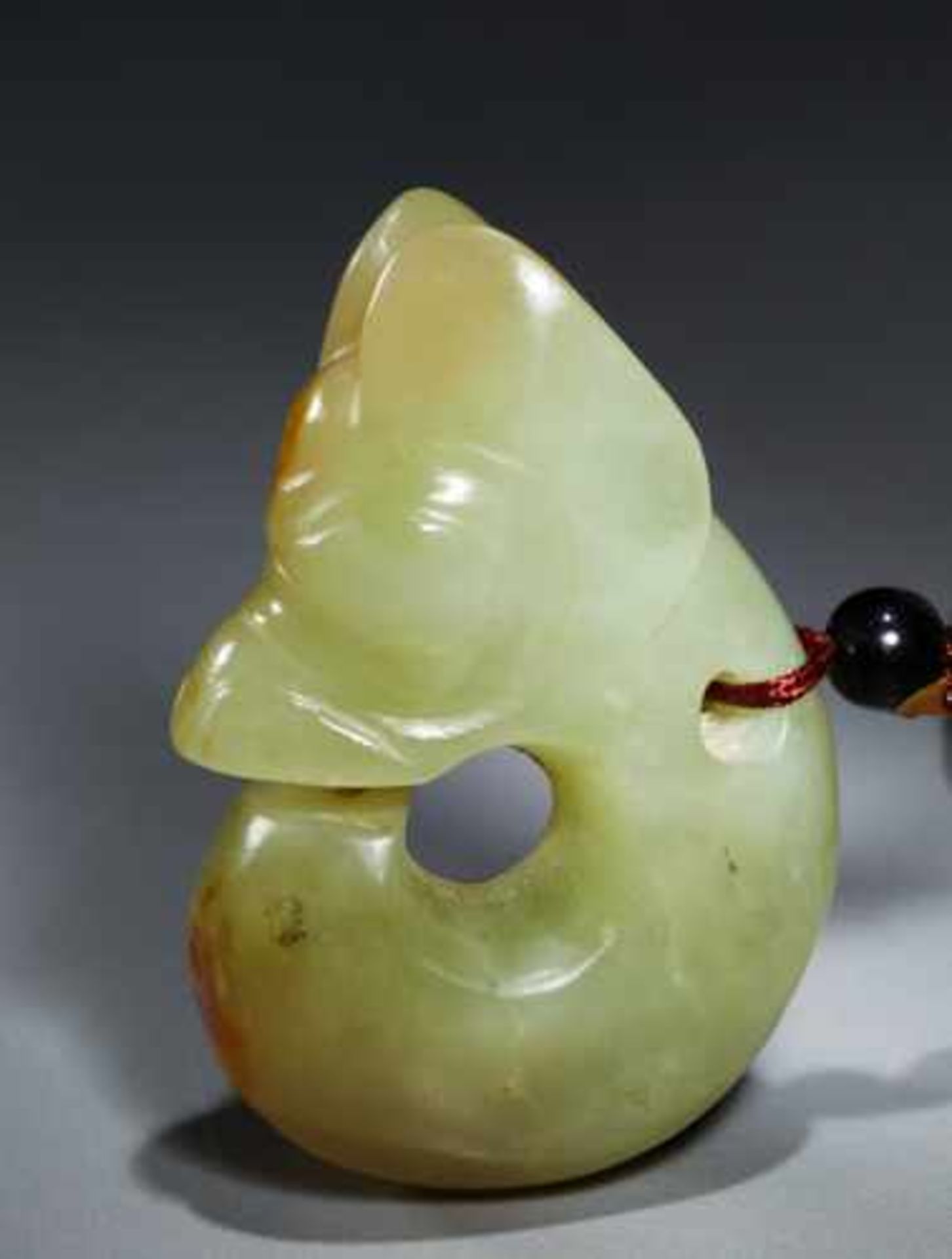 A CHARMING SMALL “PIG-DRAGON” – ZHULONG Jade, China. Late Neolithic period, Hongshan culture, c. - Image 4 of 6