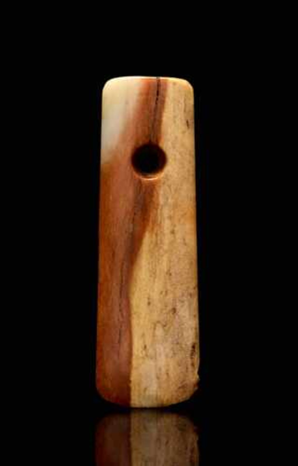 A SMALL AXE-SHAPED PENDANT CARVED IN BEAUTIFULLY COLOURED JADE Jade, China. Late Neolithic period,