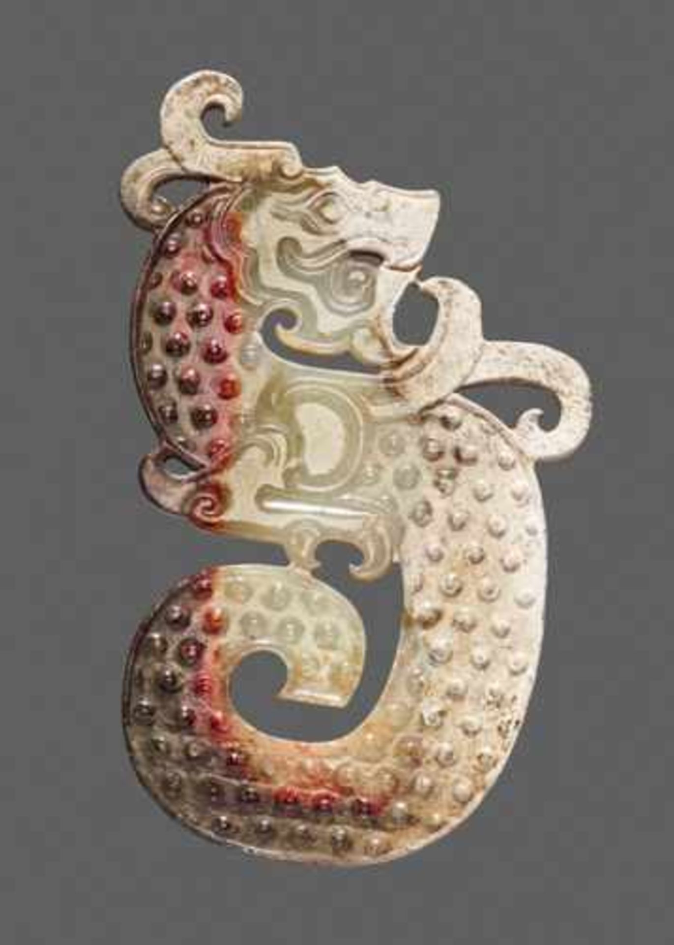 A STRIKING KUI S-SHAPED DRAGON IN WHITE JADE WITH A BROWN STRIPE Jade, China. Early Western Han