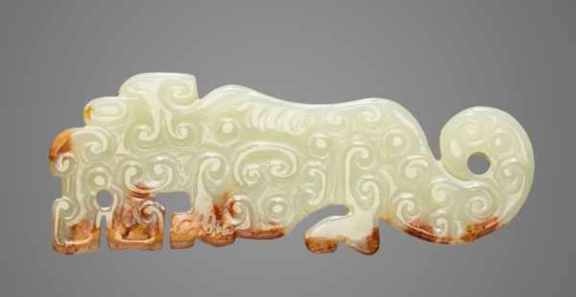 SMALL TIGER-SHAPED ORNAMENT IN TRANSLUCENT GREEN JADE Jade, China. Eastern Zhou, late Spring and - Image 2 of 8