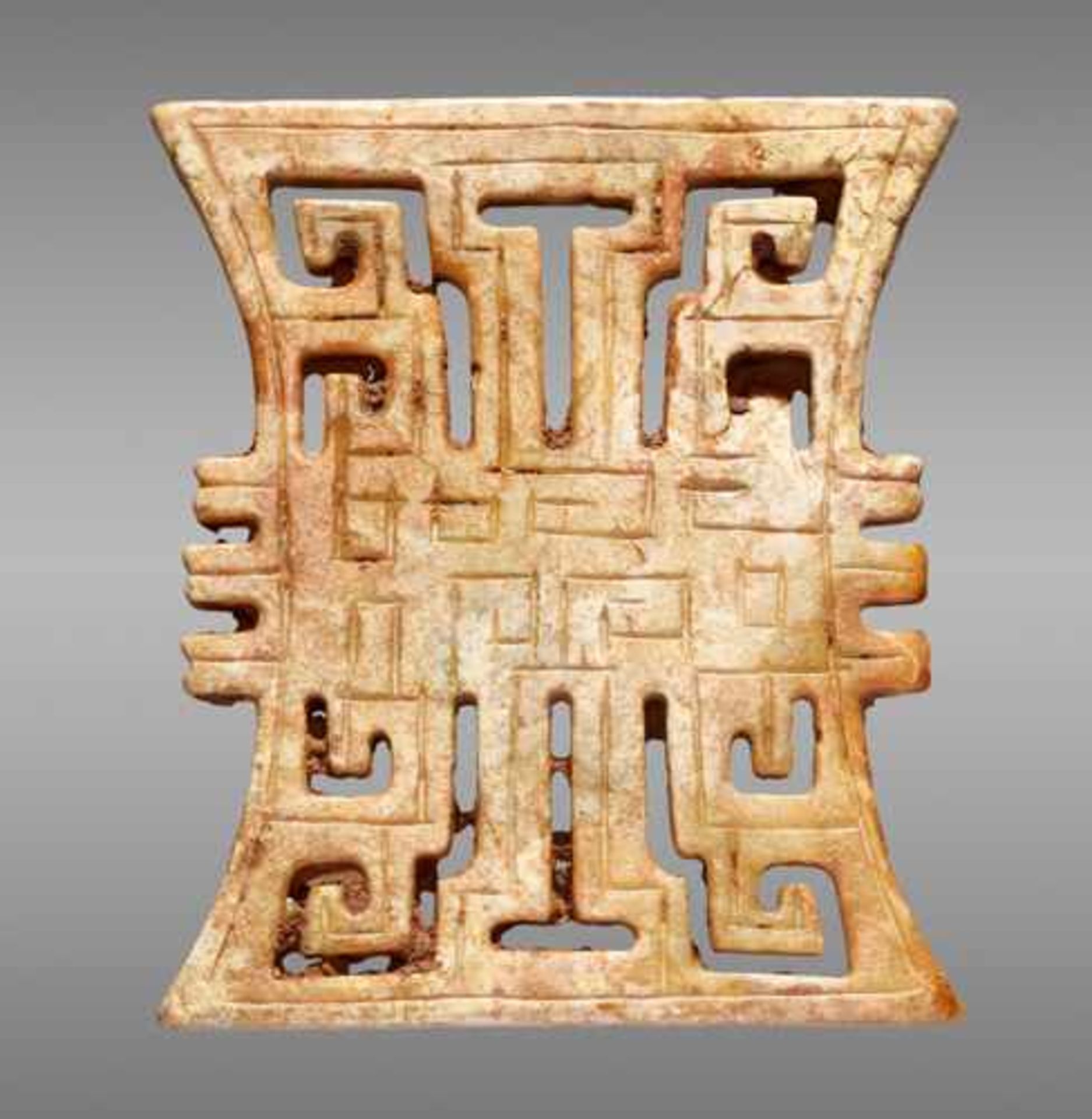 AN INTERESTING ORNAMENT WITH A GEOMETRIC OPENWORK DESIGN AND STRIKING OUTLINE Jade, China. Eastern