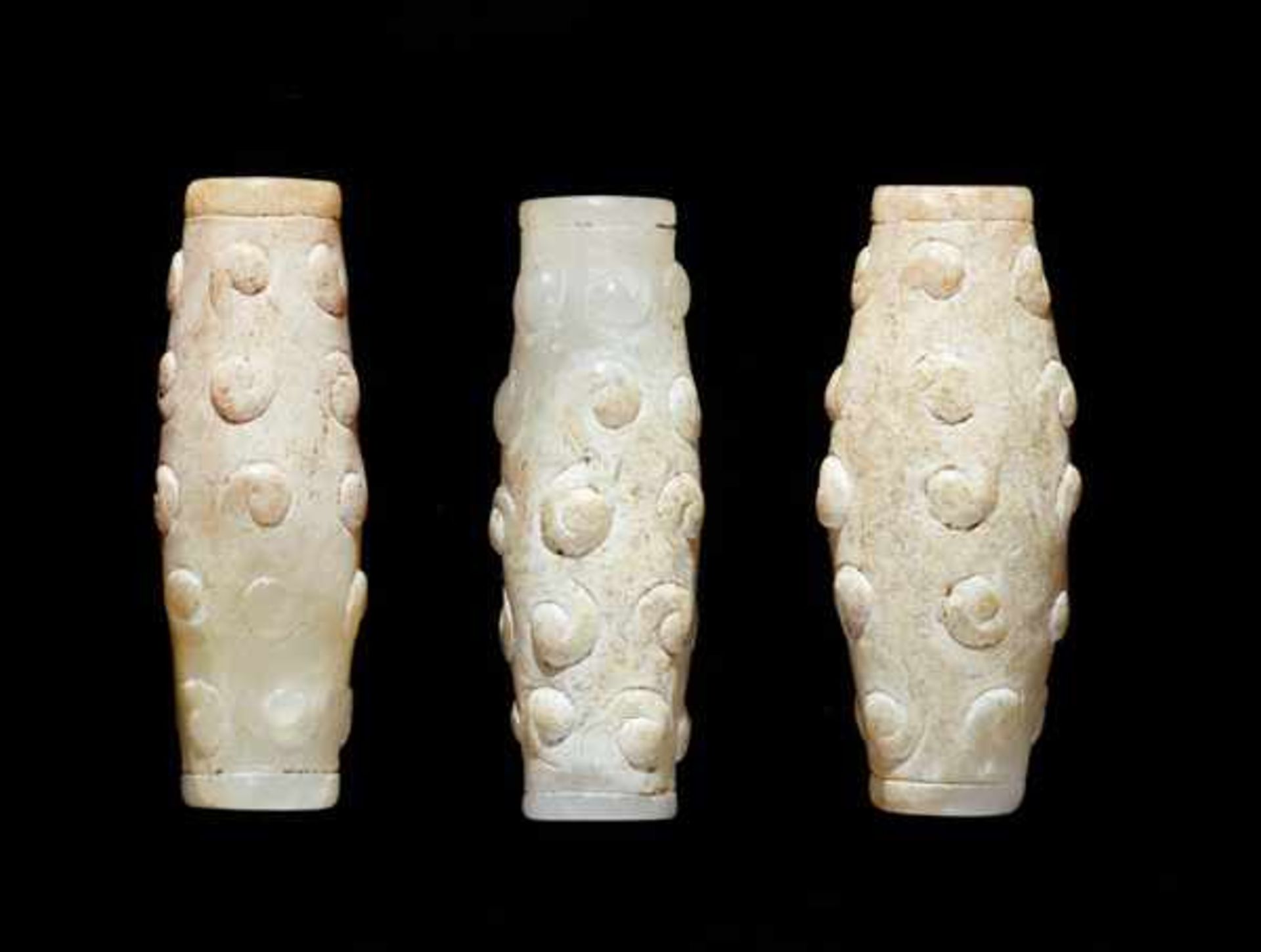 THREE TINY BEADS IN WHITE JADE WITH DELICATELY CARVED SCROLLS IN RELIEF Jade, China. Eastern Zhou, - Image 3 of 8
