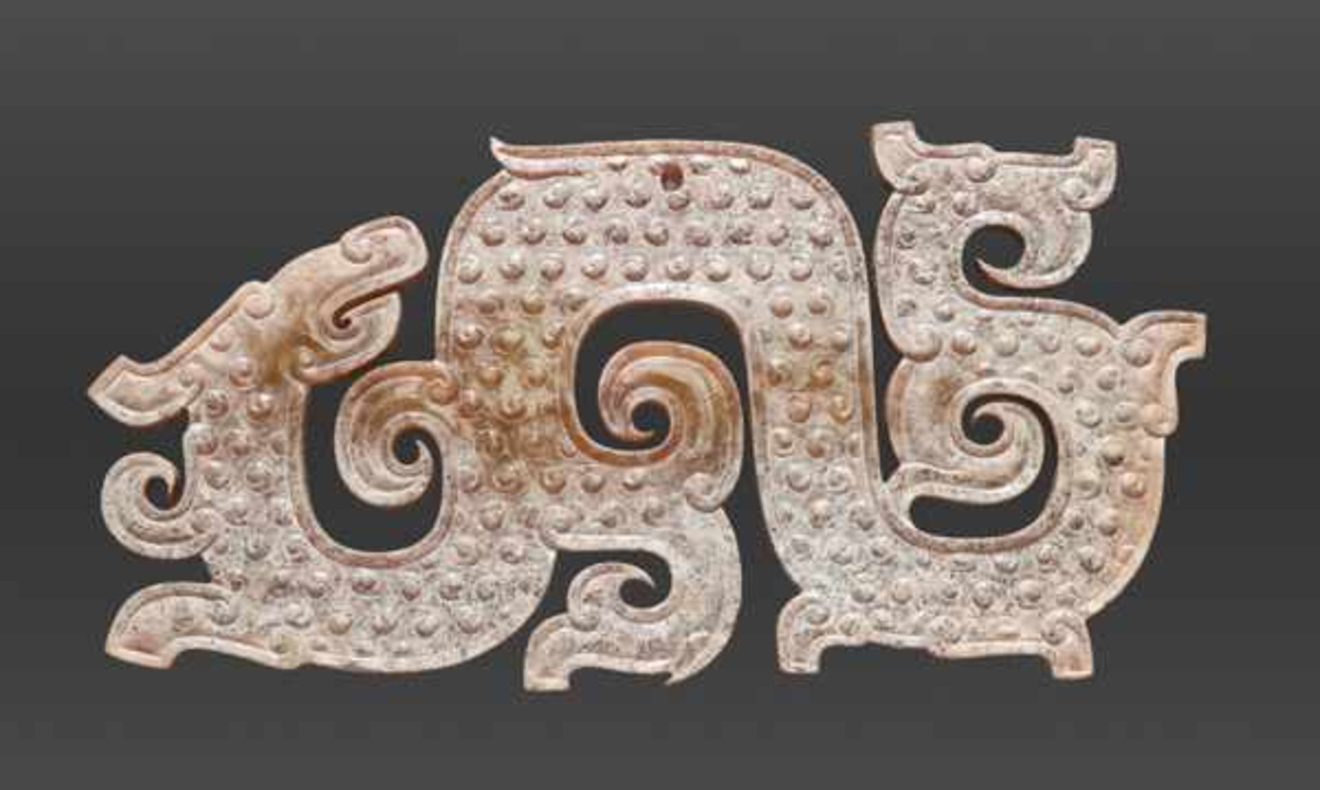 AN ELABORATE DRAGON-SHAPED PENDANT WITH CURLED APPENDAGES Jade, China. Eastern Zhou, 5th - 4th - Image 2 of 4