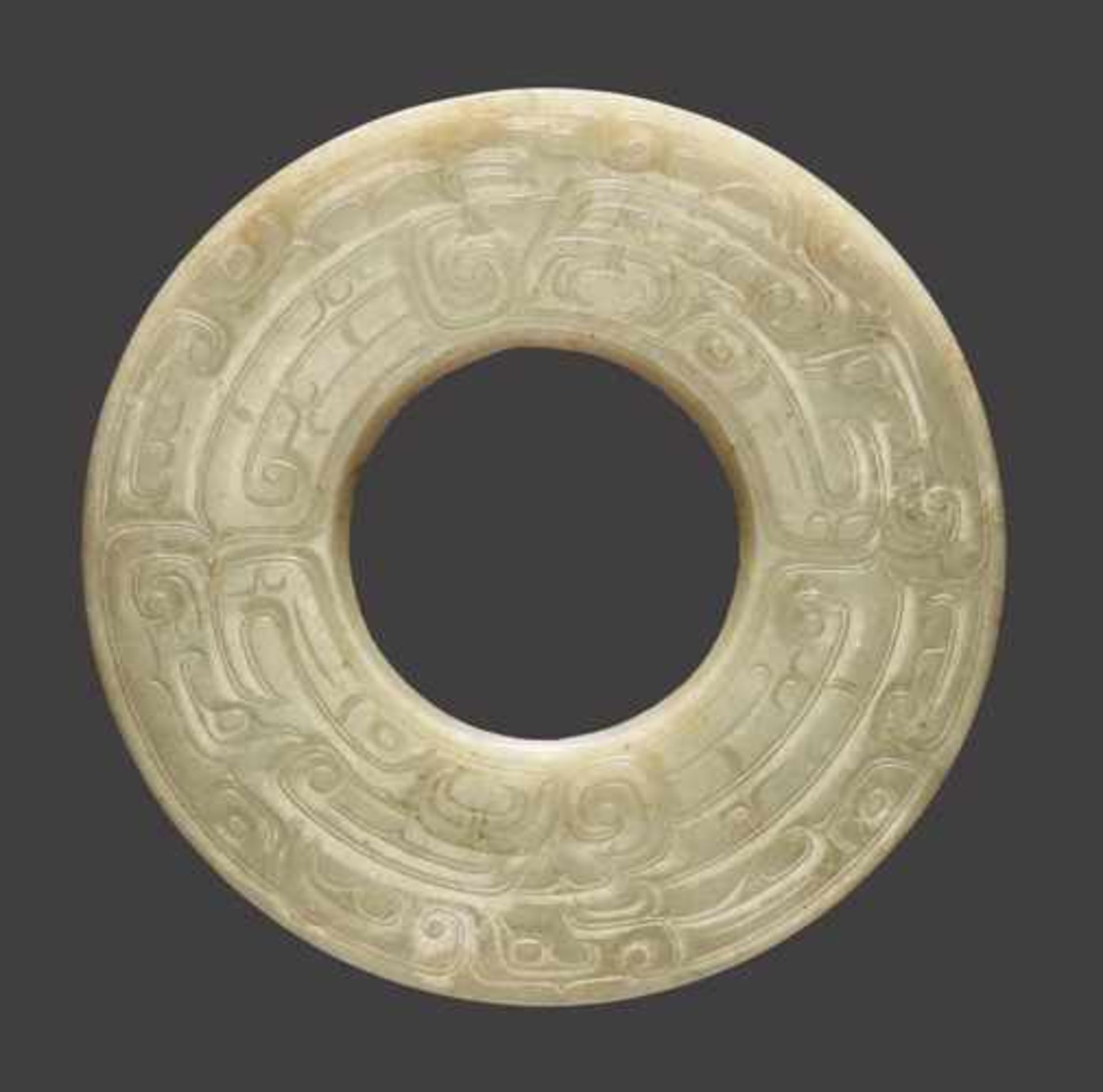A LARGE DISC IN LIGHT GREEN JADE WITH A DOUBLE ONELEGGED DRAGON (KUI) DESIGN Jade, China. Late - Image 2 of 6