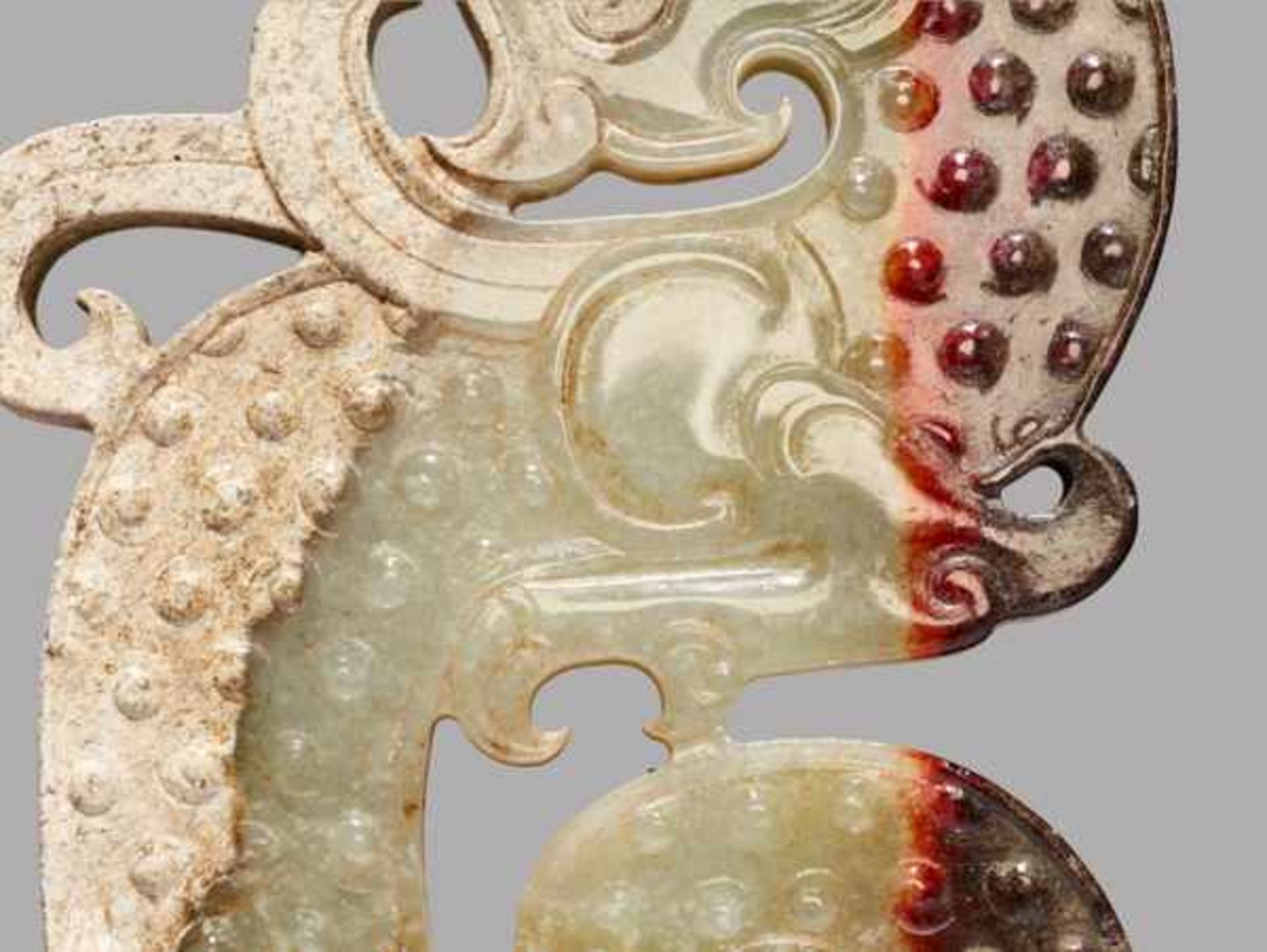 A STRIKING KUI S-SHAPED DRAGON IN WHITE JADE WITH A BROWN STRIPE Jade, China. Early Western Han - Image 4 of 7