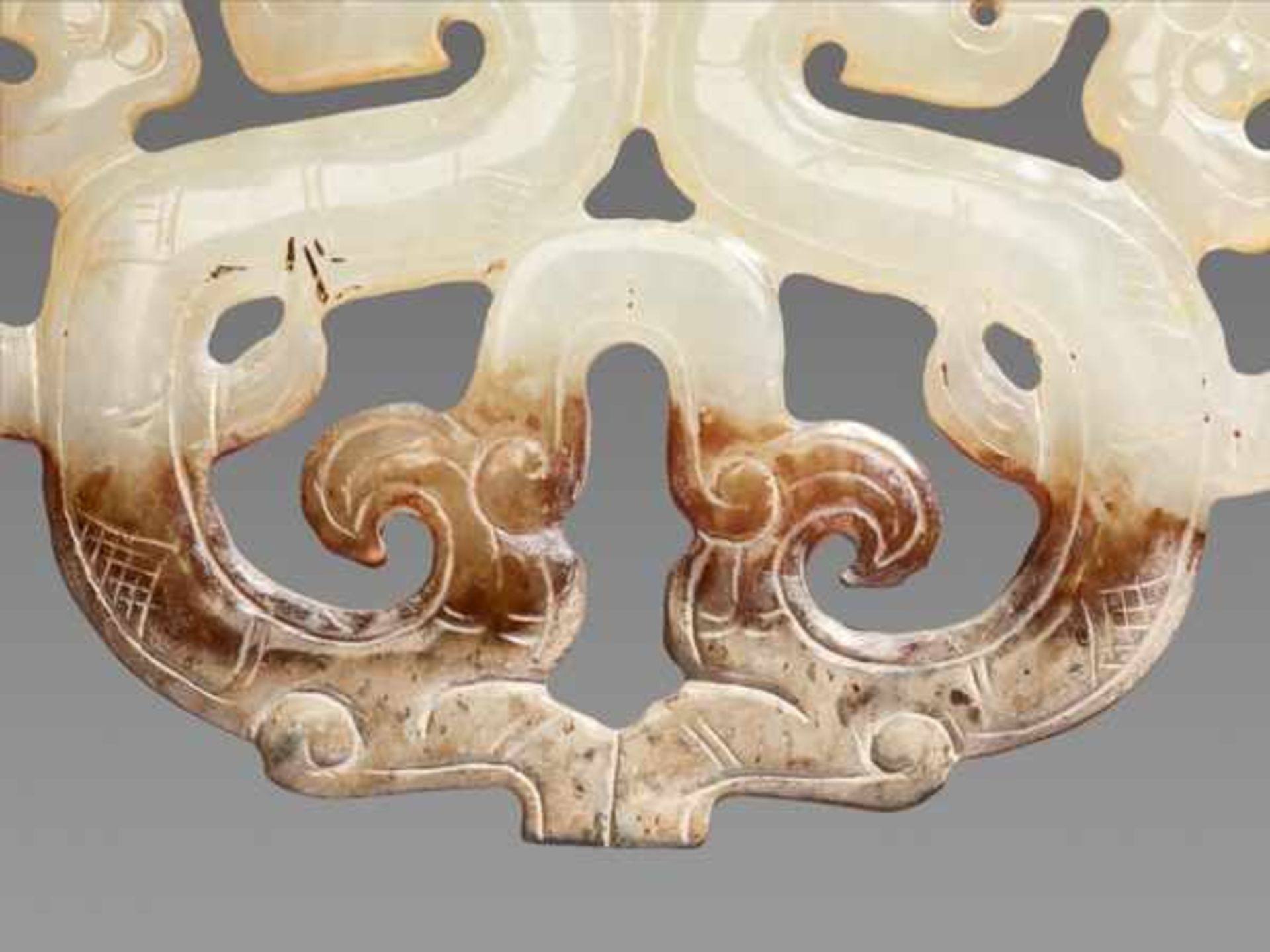 A GRACEFUL ORNAMENT IN OPENWORK WITH DRAGON AND PHOENIX MOTIF Jade, China. Eastern Zhou, Warring - Image 4 of 8