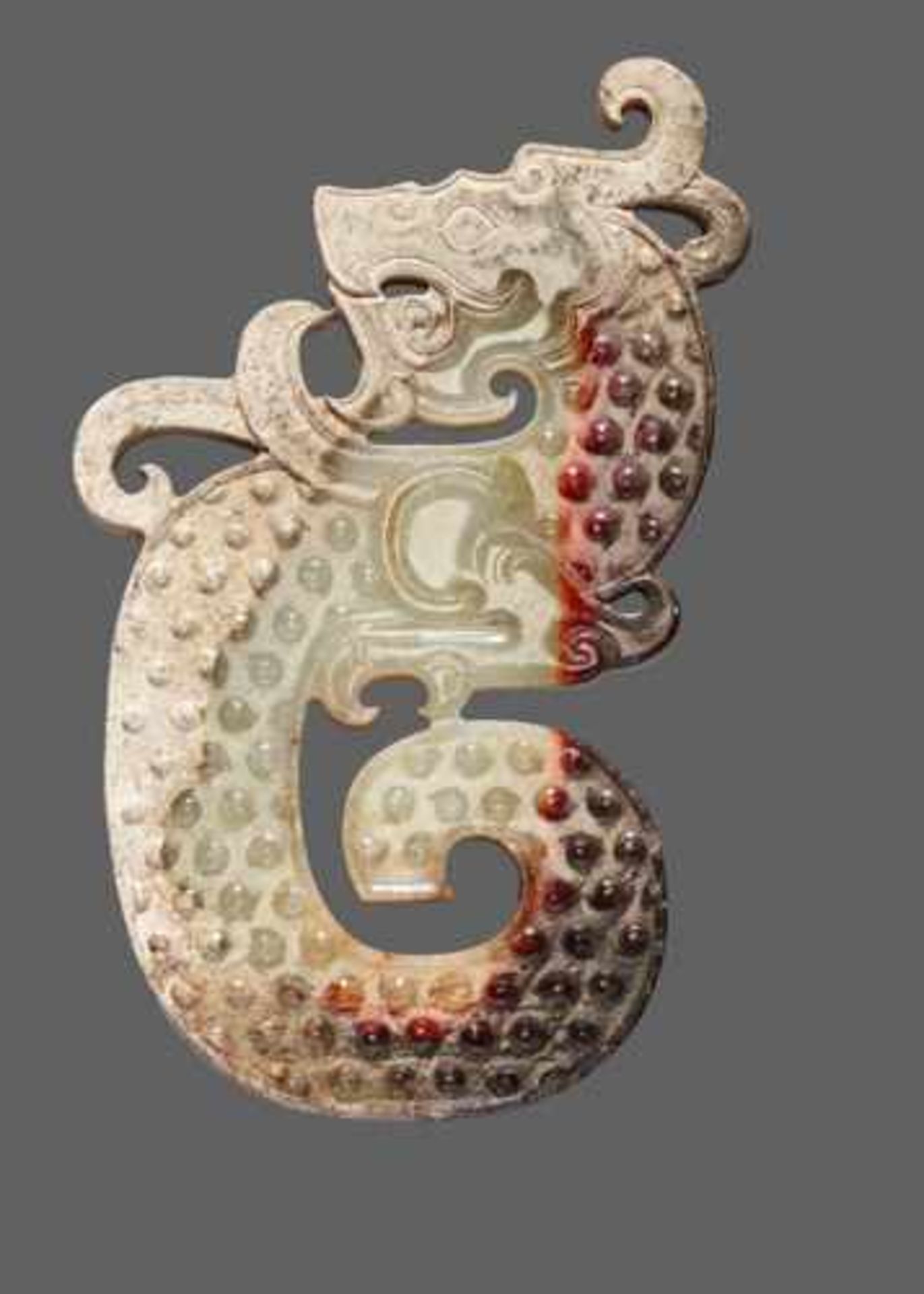 A STRIKING KUI S-SHAPED DRAGON IN WHITE JADE WITH A BROWN STRIPE Jade, China. Early Western Han - Image 2 of 7