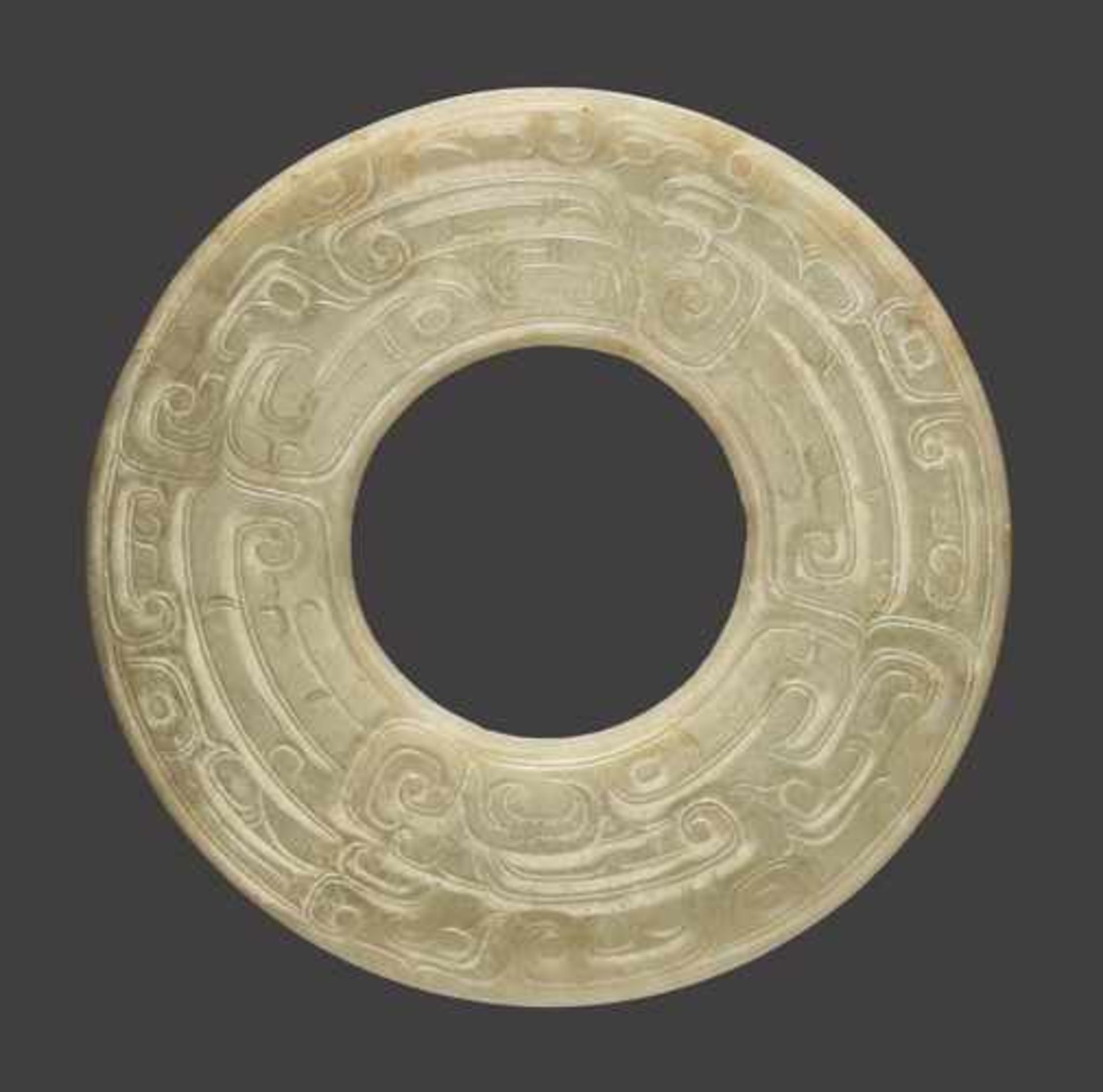A LARGE DISC IN LIGHT GREEN JADE WITH A DOUBLE ONELEGGED DRAGON (KUI) DESIGN Jade, China. Late