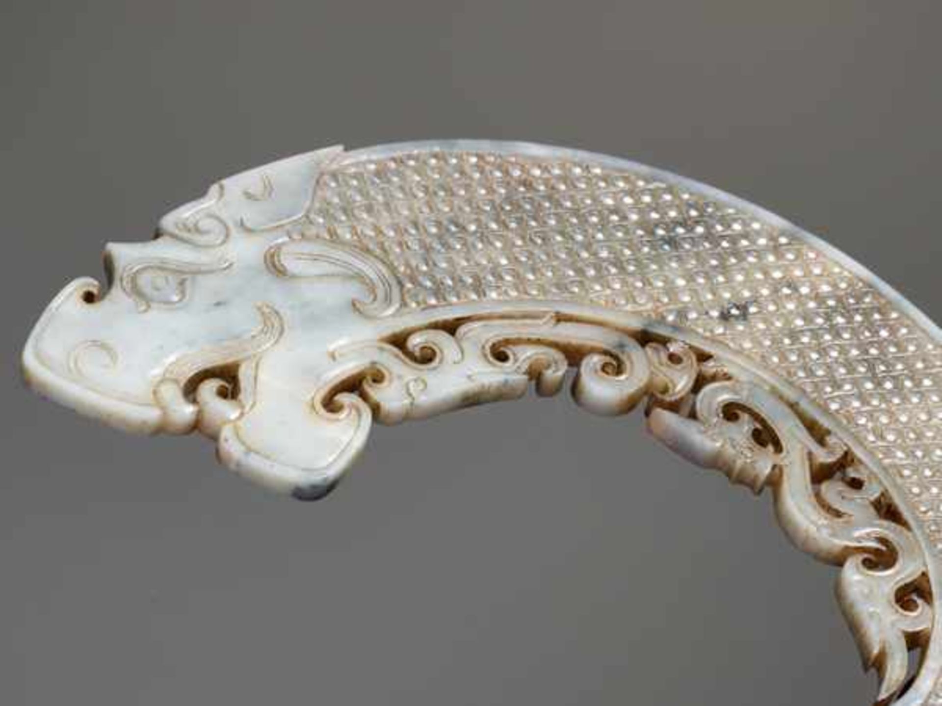 AN EXQUISITE ARCHED DRAGON WITH ORNATE OPENWORK Jade, China. Early Western Han Dynasty, 2nd - Image 4 of 6