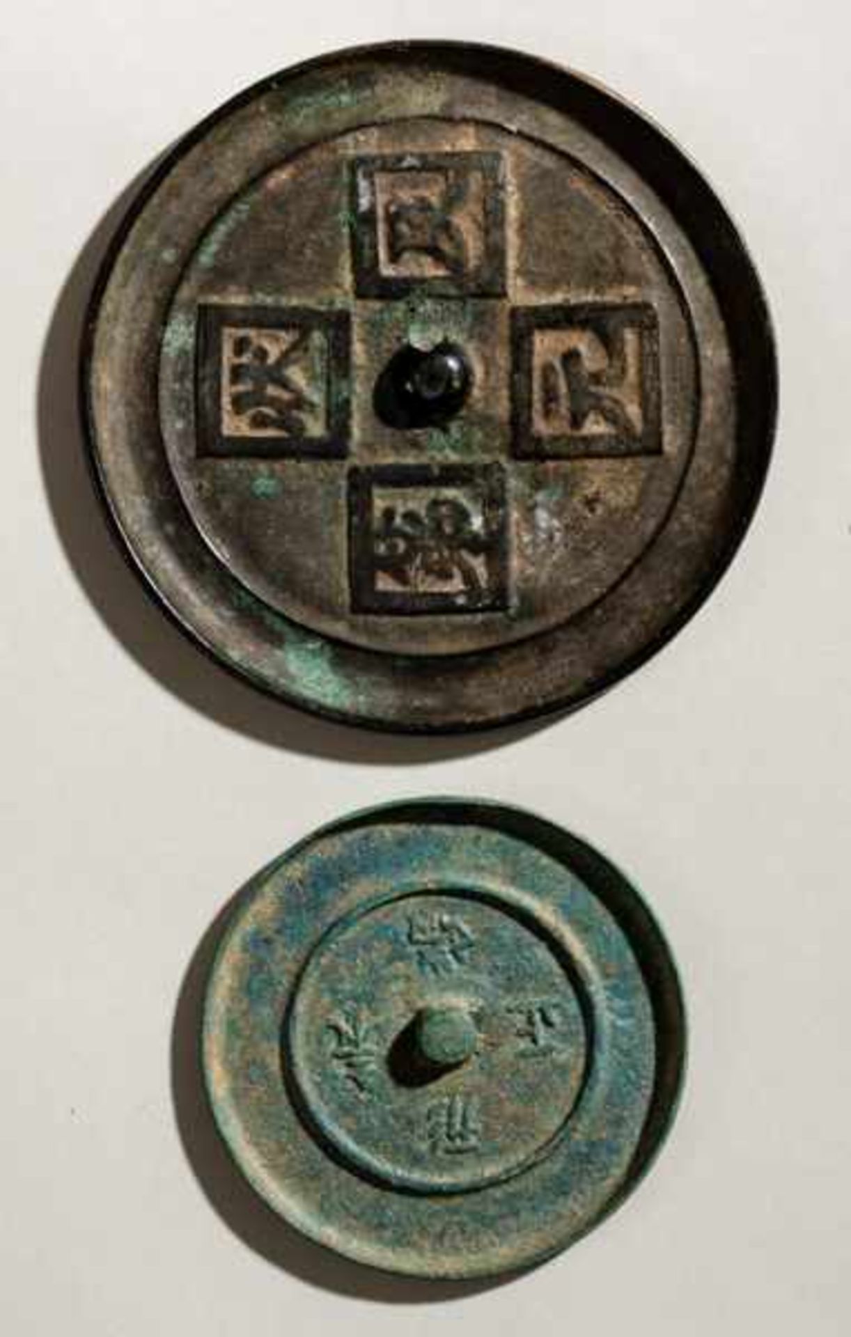 TWO MIRRORS WITH INSCRIPTIONS Bronze. China, Ming dynasty (1348 - 1644)2個文字紋銅鏡The smaller mirror