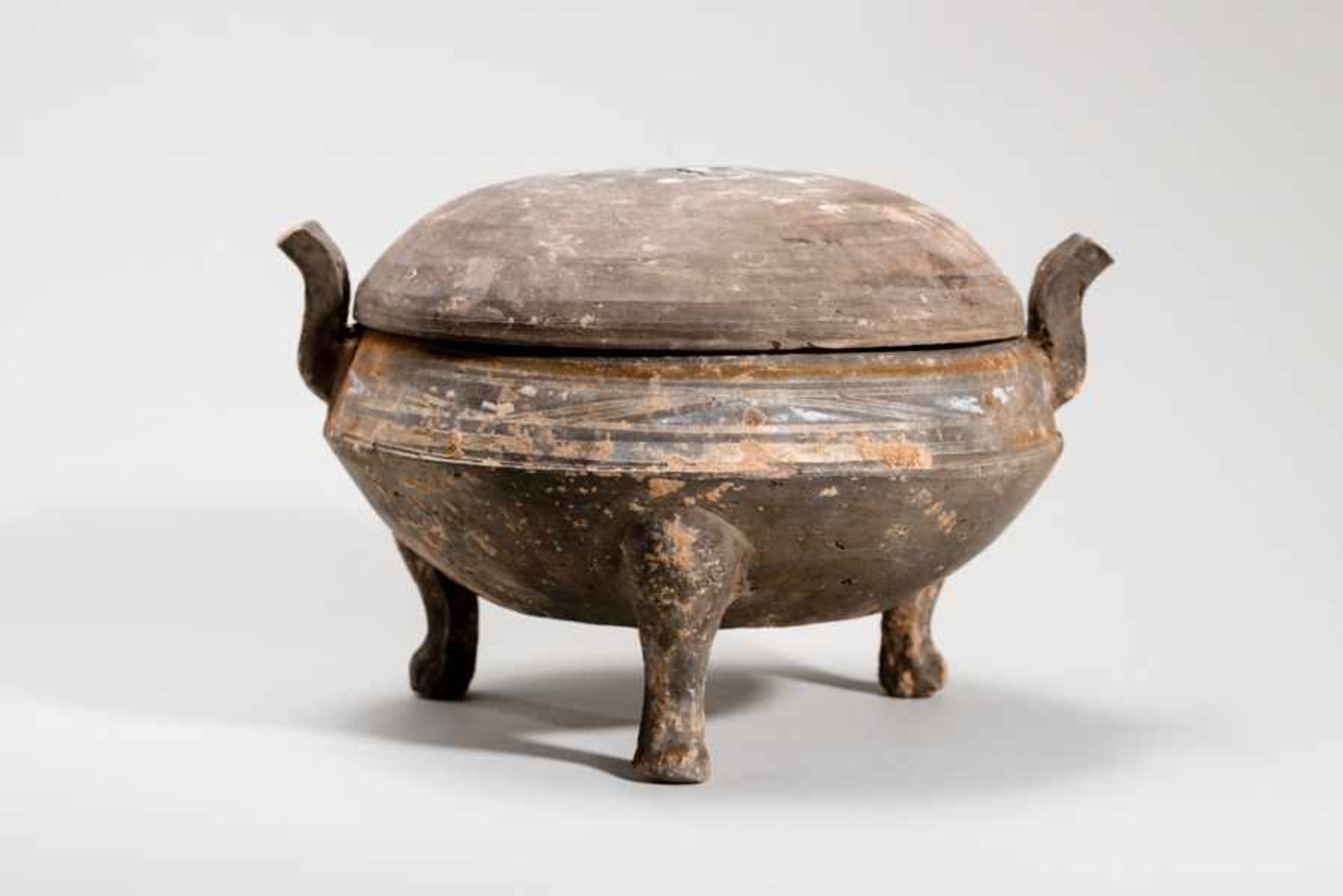 TRIPOD VESSEL WITH LID Terracotta with remnants of original painting. China, Western Han dynasty (