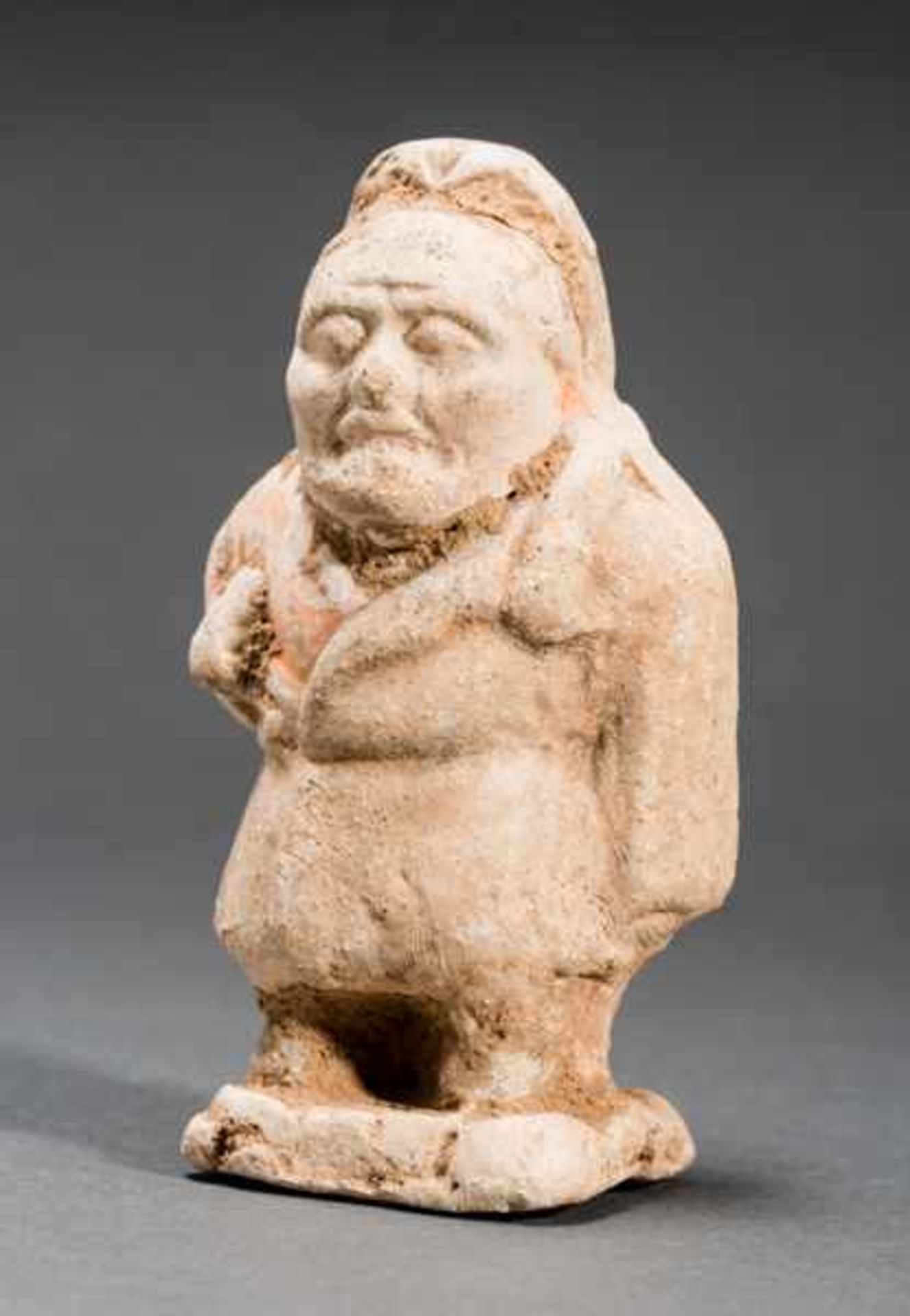 RARE DEPICTION OF A DWARF Terracotta with remnants of original painting. China, Tang dynasty, (618 -