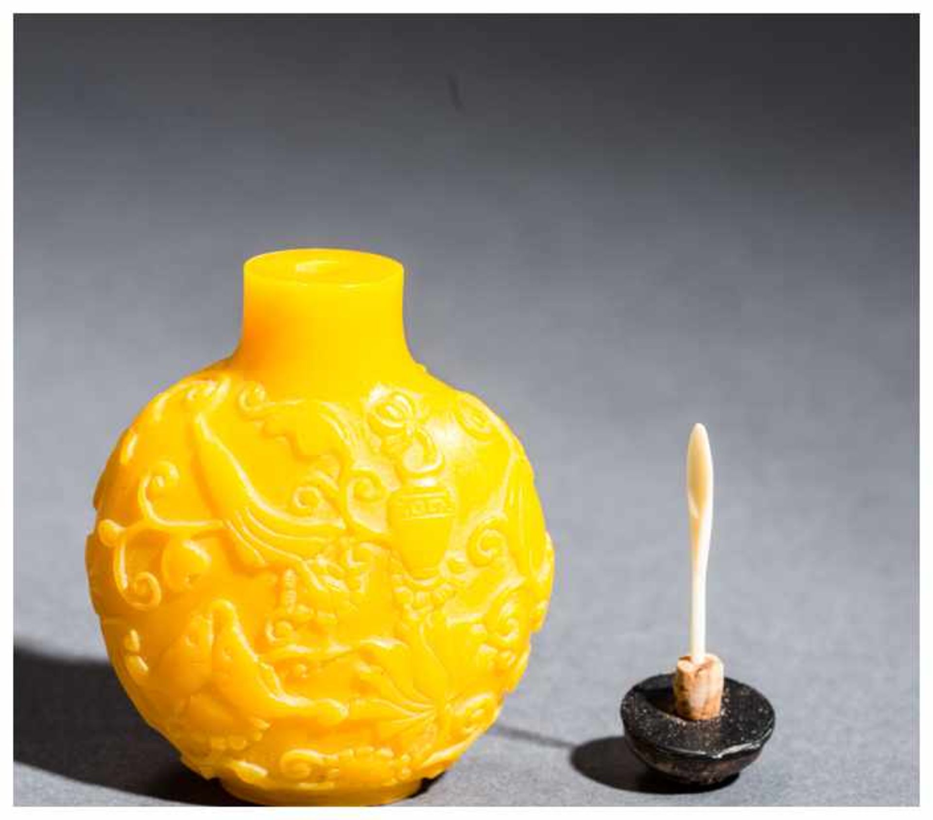 SNUFF BOTTLE WITH THE EIGHT BUDDHIST EMBLEMS Imperial yellow glass. China, 20th centuryThis round - Image 3 of 4